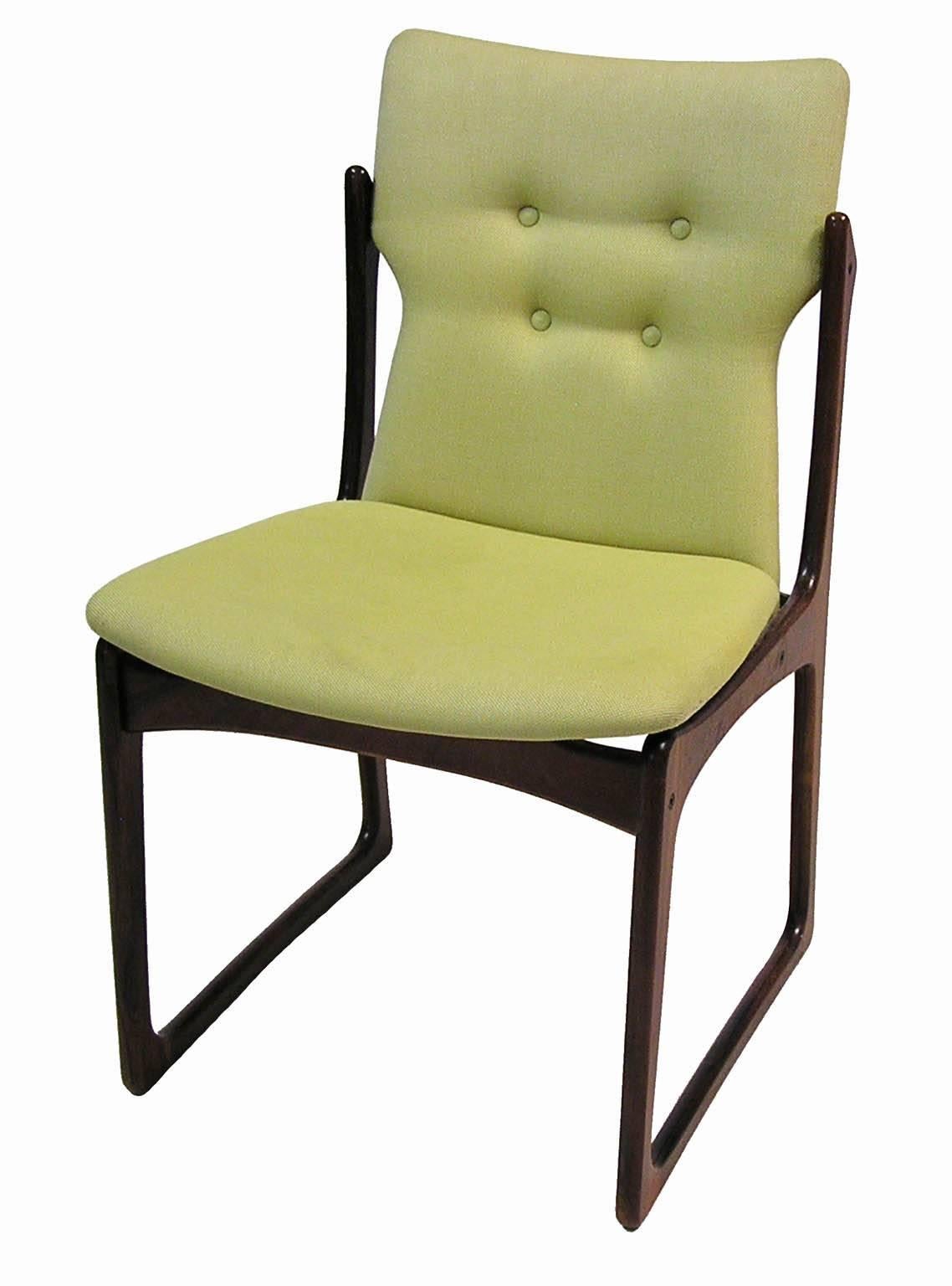 A gorgeous set of four rosewood dining chairs from the 1960s by Art furn of Denmark. Beautifully grained and featuring a stunning sculpted solid rosewood frame with original button tufted fabric upholstery. Set would require reupholstering but is