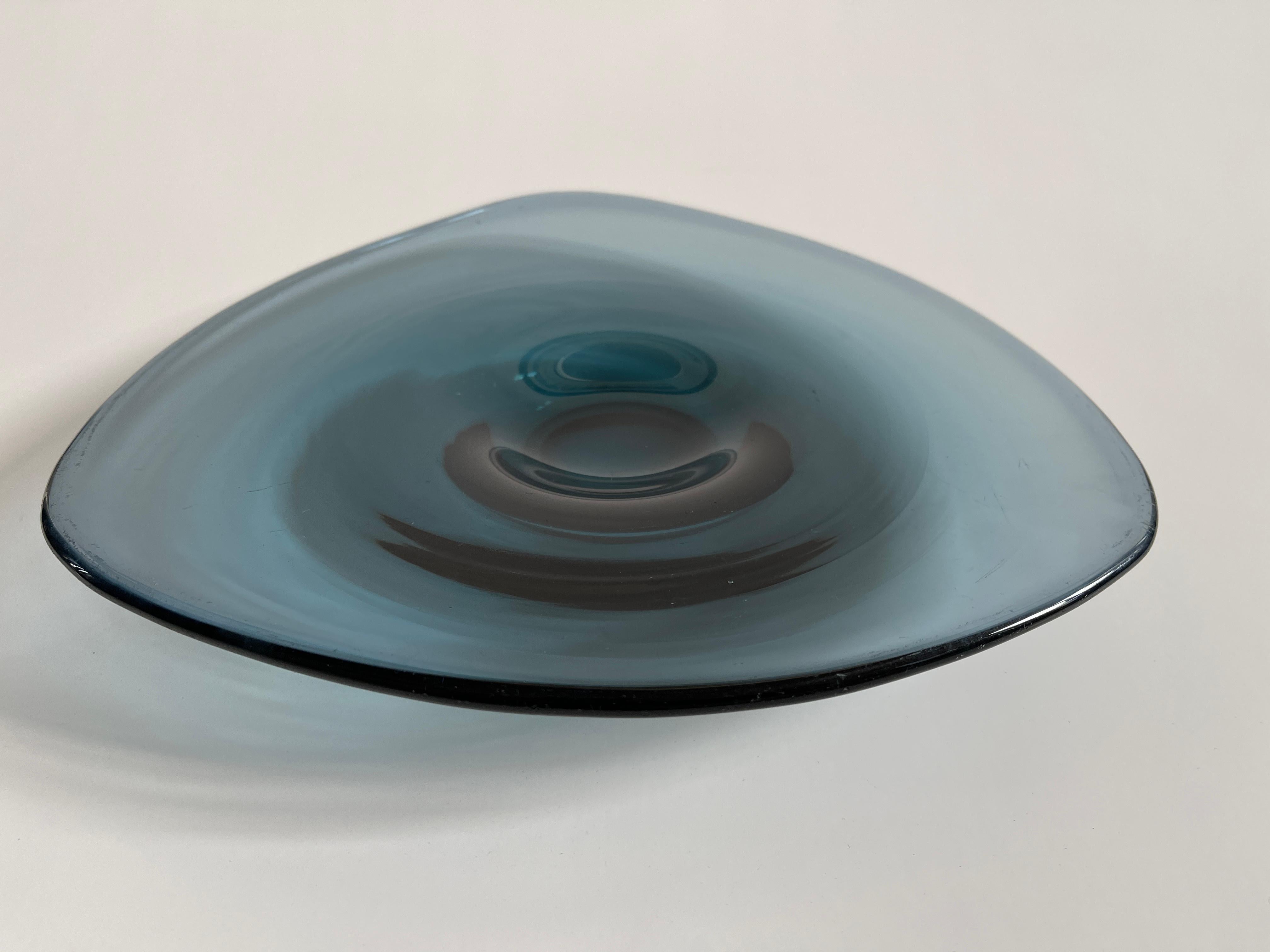 Large hand blown blue smoke glass rouleaux curved triangle bowl tray, with pedestal base, unsigned. Hand made in Denmark, c. 1960s.