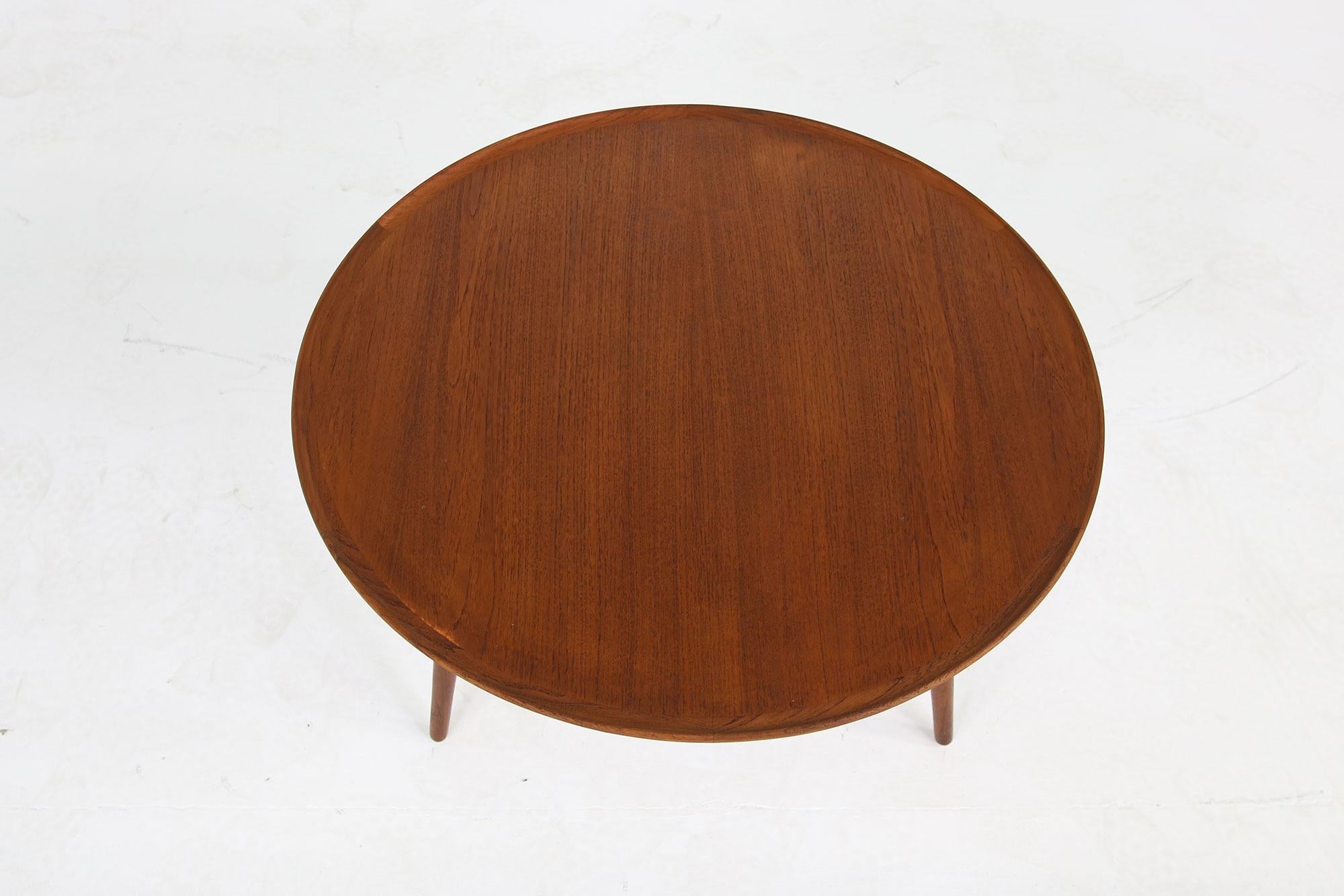 Beautiful 1960s Danish modern coffee table, made in Denmark, beautiful vintage table, fantastic condition, early edition, teak wood, tripod table.
 