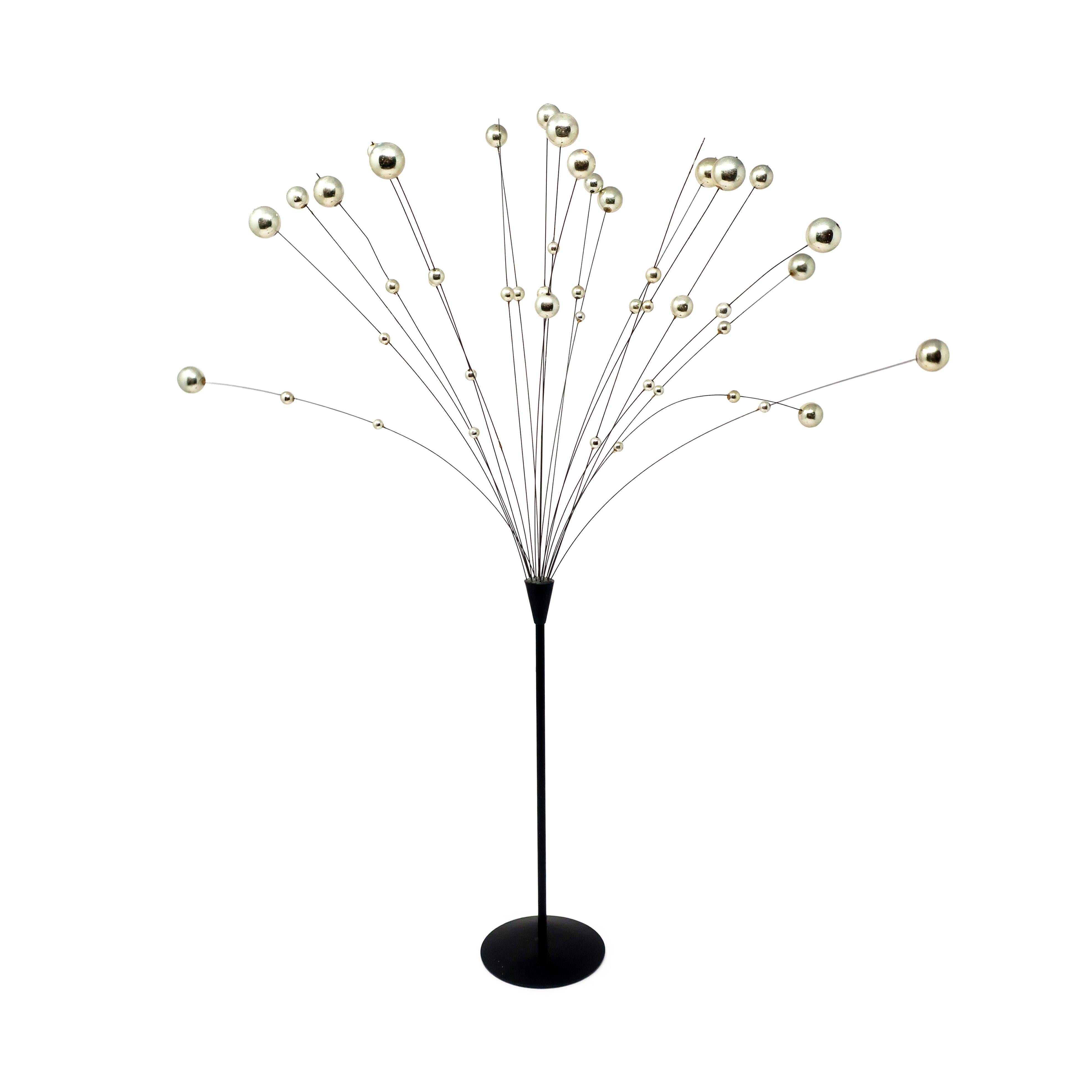 A vintage kinetic ball sculpture in black and silver by Laurids Lonborg, a Danish housewares and decorative objects powerhouse.  Black metal base and stem, silver metal wires, and polished silver colored balls that gently sway with any movement,
