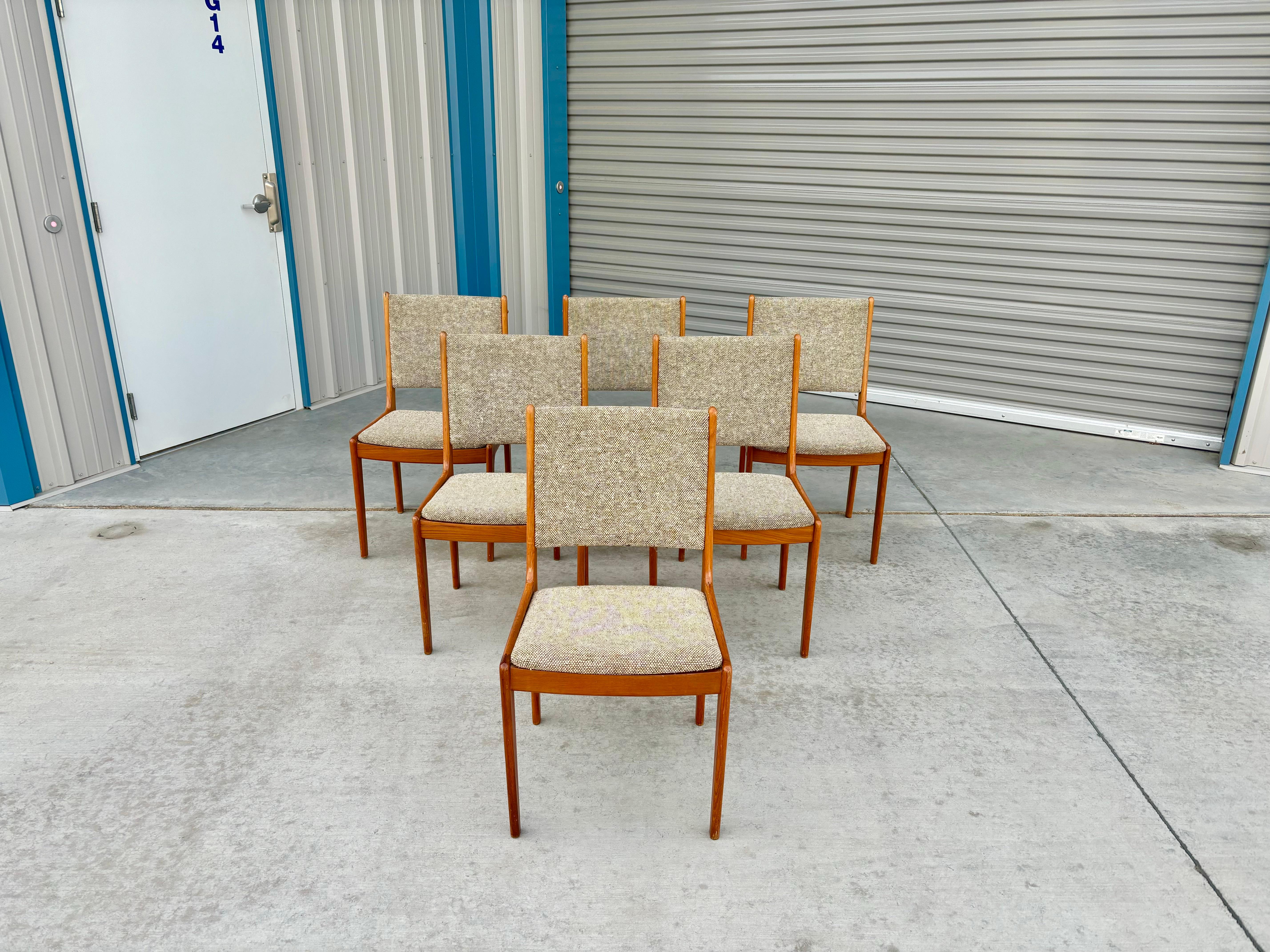 Danish modern teak dining chairs were designed and manufactured in Denmark circa the 1960s. The teak frame is not only sturdy but also adds a touch of warmth to the design, while the original upholstery provides both comfort and character. Whether