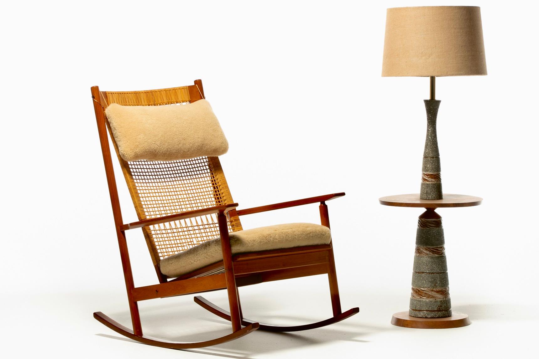 Beautiful early 1960s Danish teak and cane rocking chair Model 532A designed by Hans Olsen and produced by Juul Kristensen. This Danish Modern rocking chair exudes a warm and nurturing energy. Throughout the last 6 decades, the teak frame was