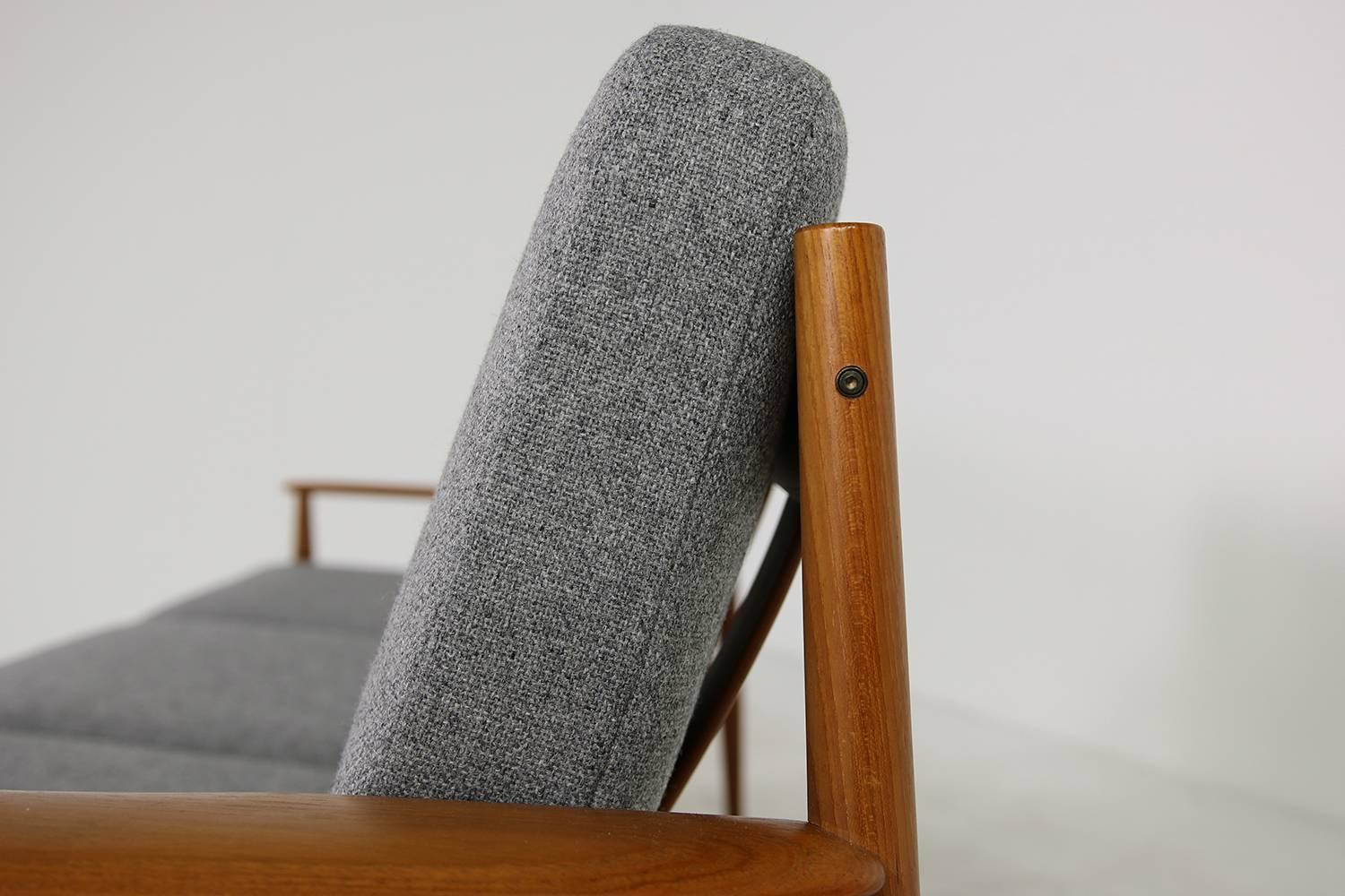 Beautiful Danish modern sofa, 1960s by Grete Jalk, beautiful sofa, very good condition and reupholstered, also covered with new woven fabric in grey, manufactured by France & Son Denmark.
 