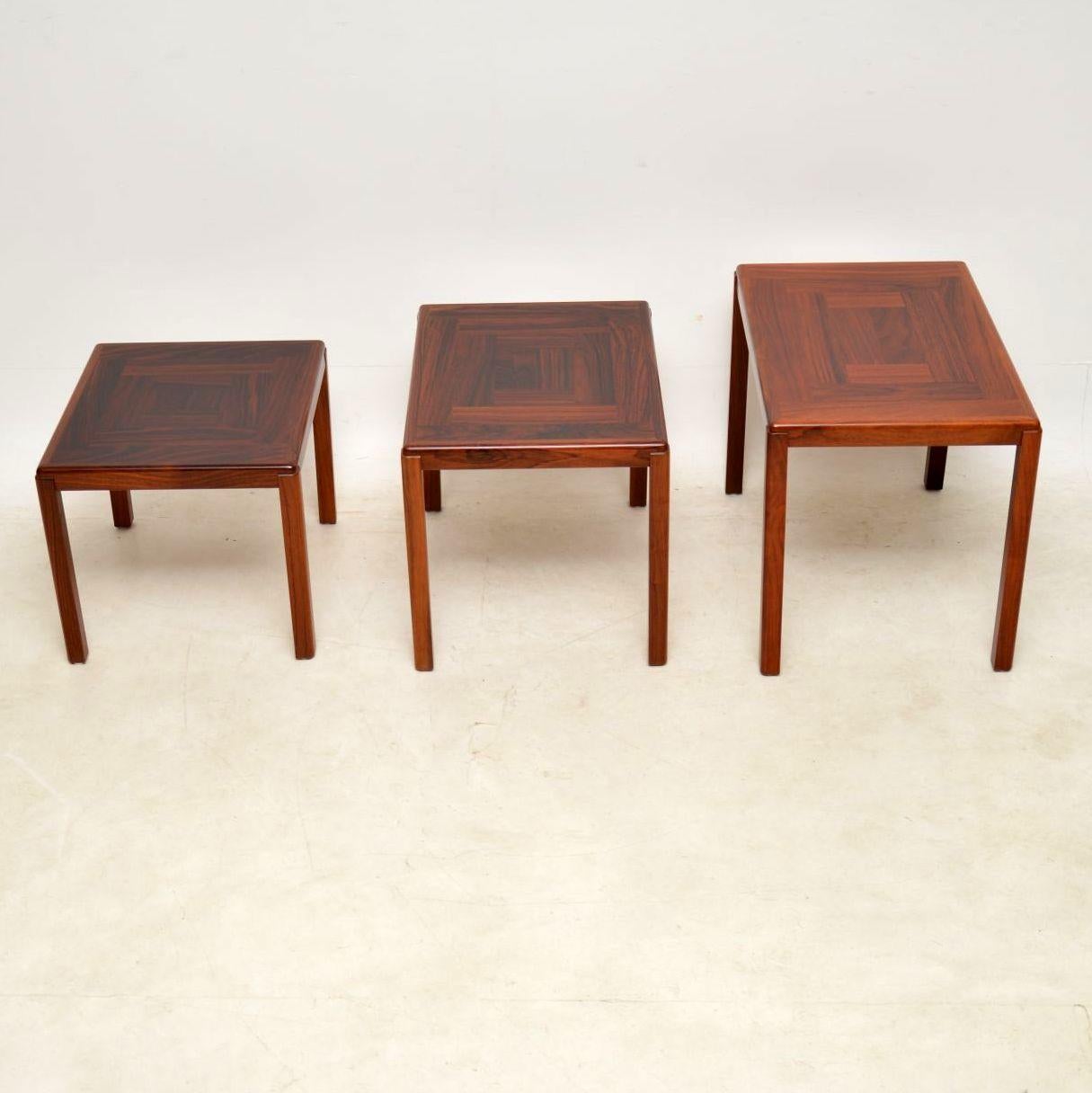 A beautiful and extremely high quality Danish nest of three tables, these date from circa 1960-1970s. Made by Vejle Stole Mobelfabrik, the makers stamp is seen beneath the top. They are very, very well made, with fantastic wood grain patterns