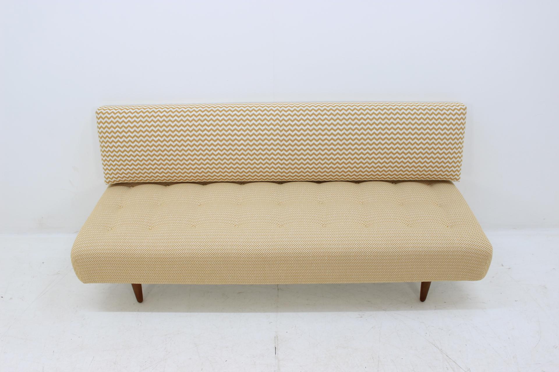 Can be easy used as a sofa or bed.
Newly upholstered and re-polished oak legs. Very good condition