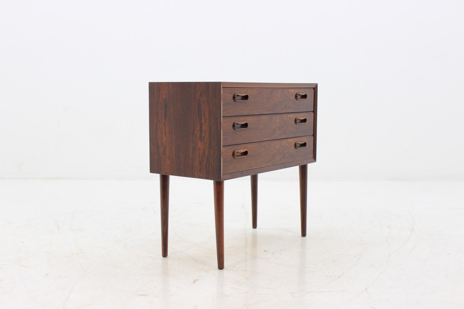 This commode features three drawers. This item was carefully restored.