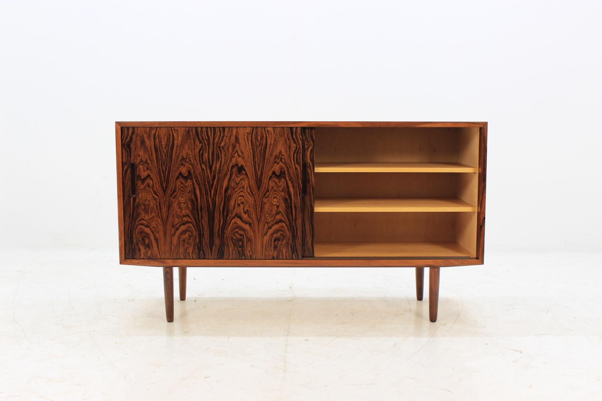 This sideboard features two sliding doors, three adjustable shelves and one-drawer. This item was carefully restored.