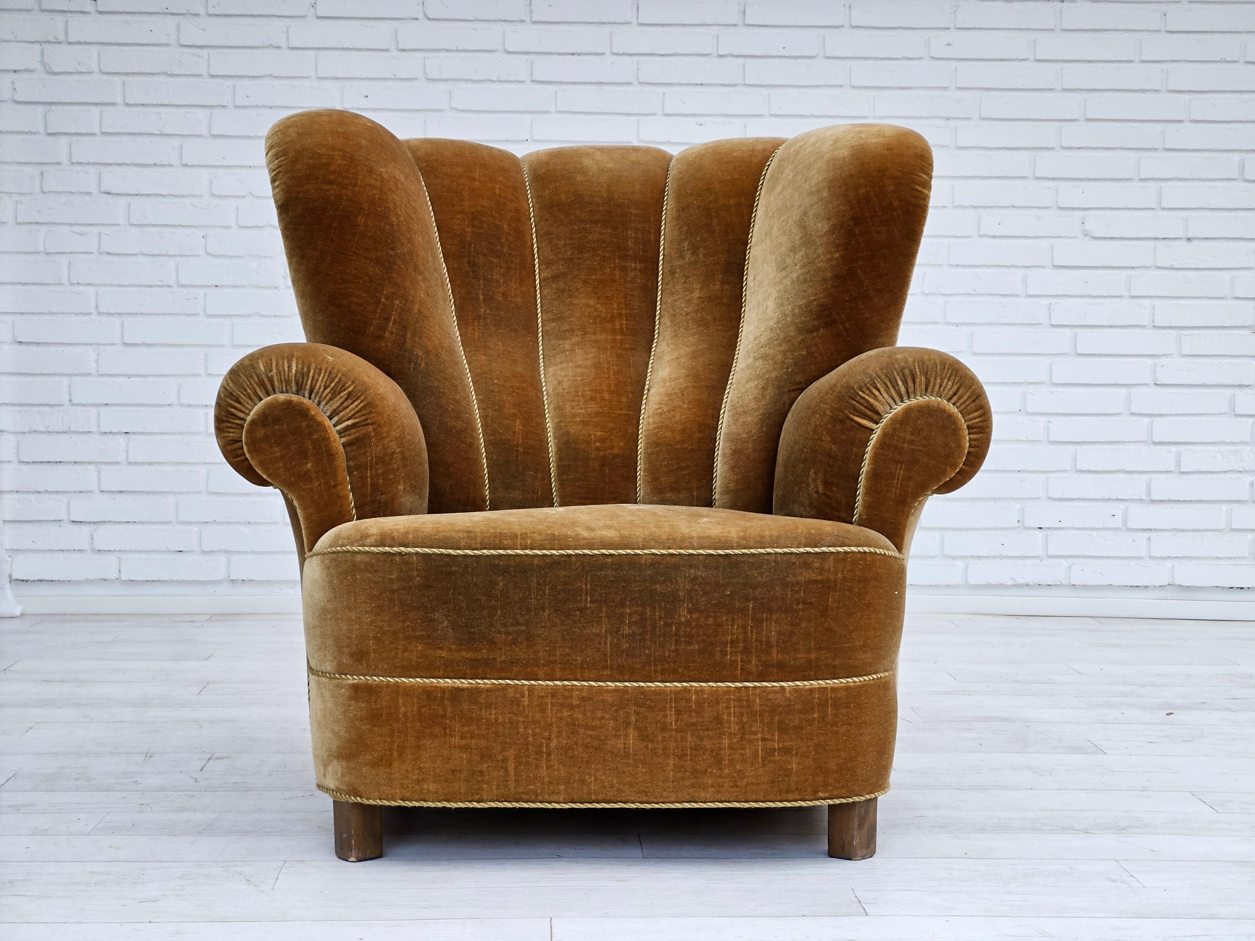 1960s, Danish reclining chair in original very good condition: no smells and no stains. Light green velour, beech wood legs, brass springs in the seat. Very comfortable, big chair, good for sleeping. Manufactured by Danish furniture manufacturer in