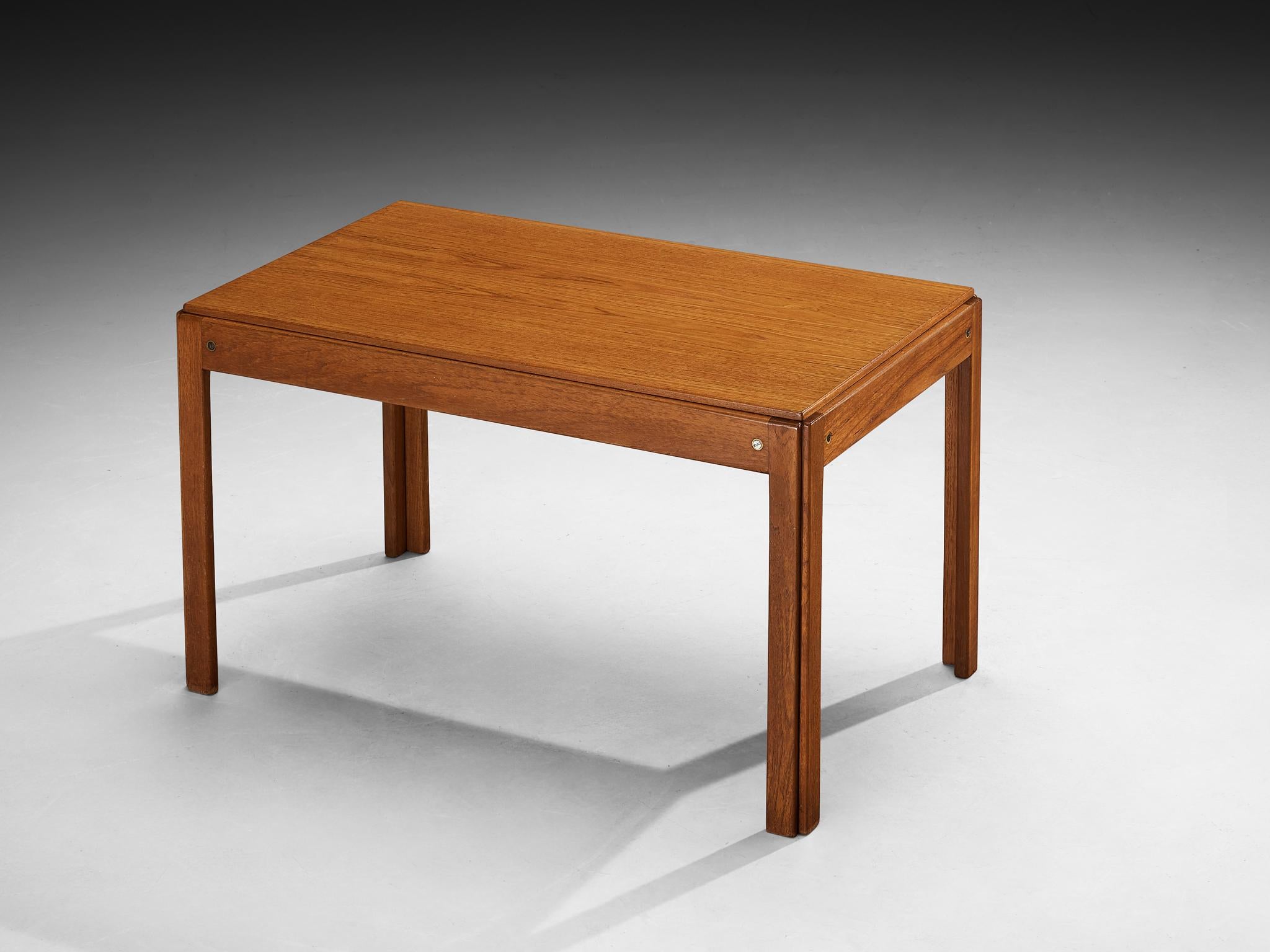 Coffee table, teak, Denmark, 1960s

This simplistic coffee table is crafted from teak, originating from Denmark and dating back to the 1960s. The design showcases clean lines and minimalist elegance, characteristic of Scandinavian modernism. The