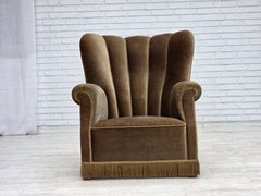 Anni '60, poltrona relax danese, rivestimento in velluto verde scuro, struttura in legno di frassino.