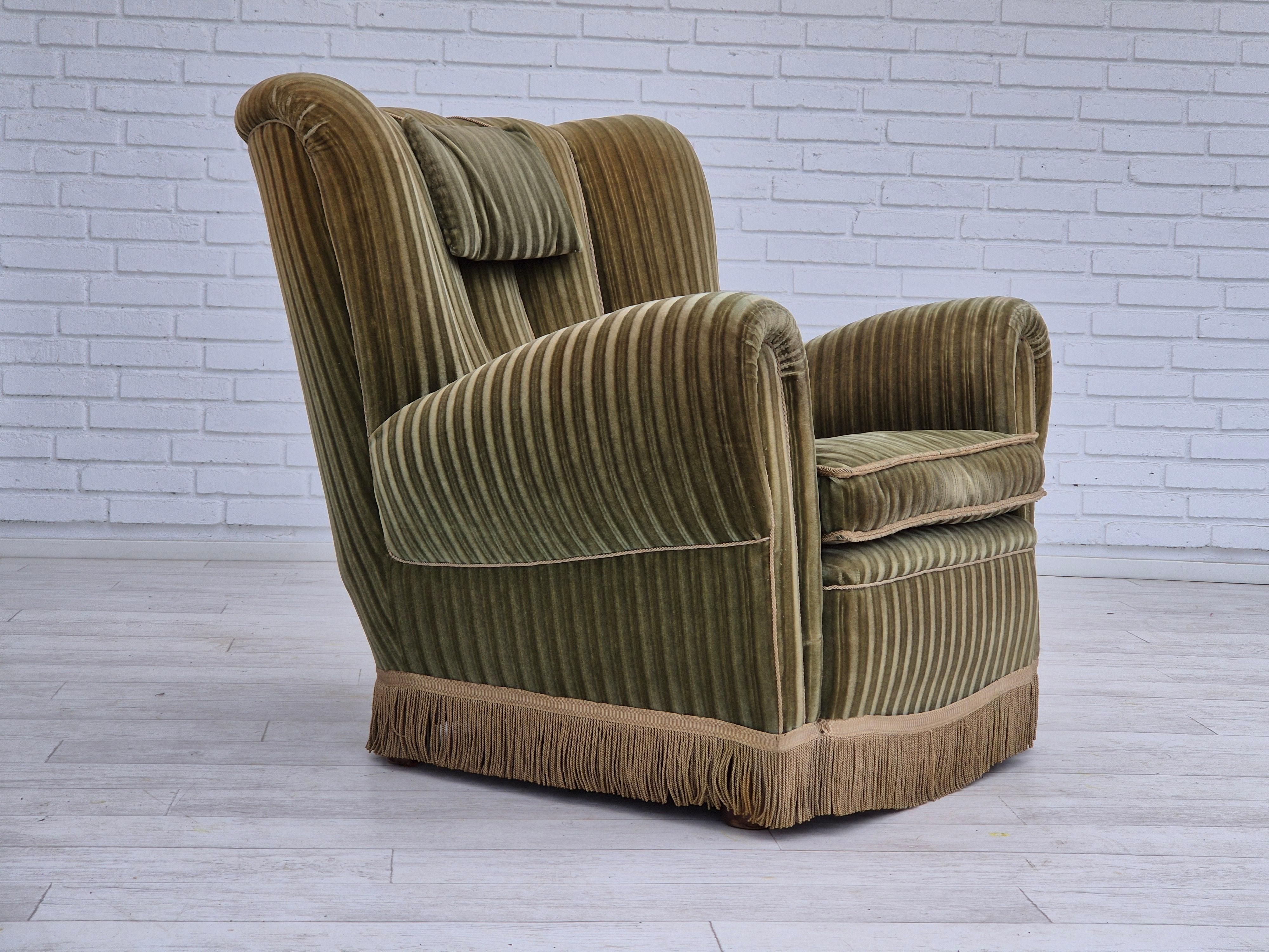 1960s, Danish relax armchair in original very good condition: no smells and no stains. Original green furniture velour. Springs in the seat, beech wood legs. Manufactured by Danish furniture manufacturer in about 1960-65s.