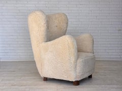 1960s, Danish relax chair, genuine sheepskin "Canberra", reupholstered.