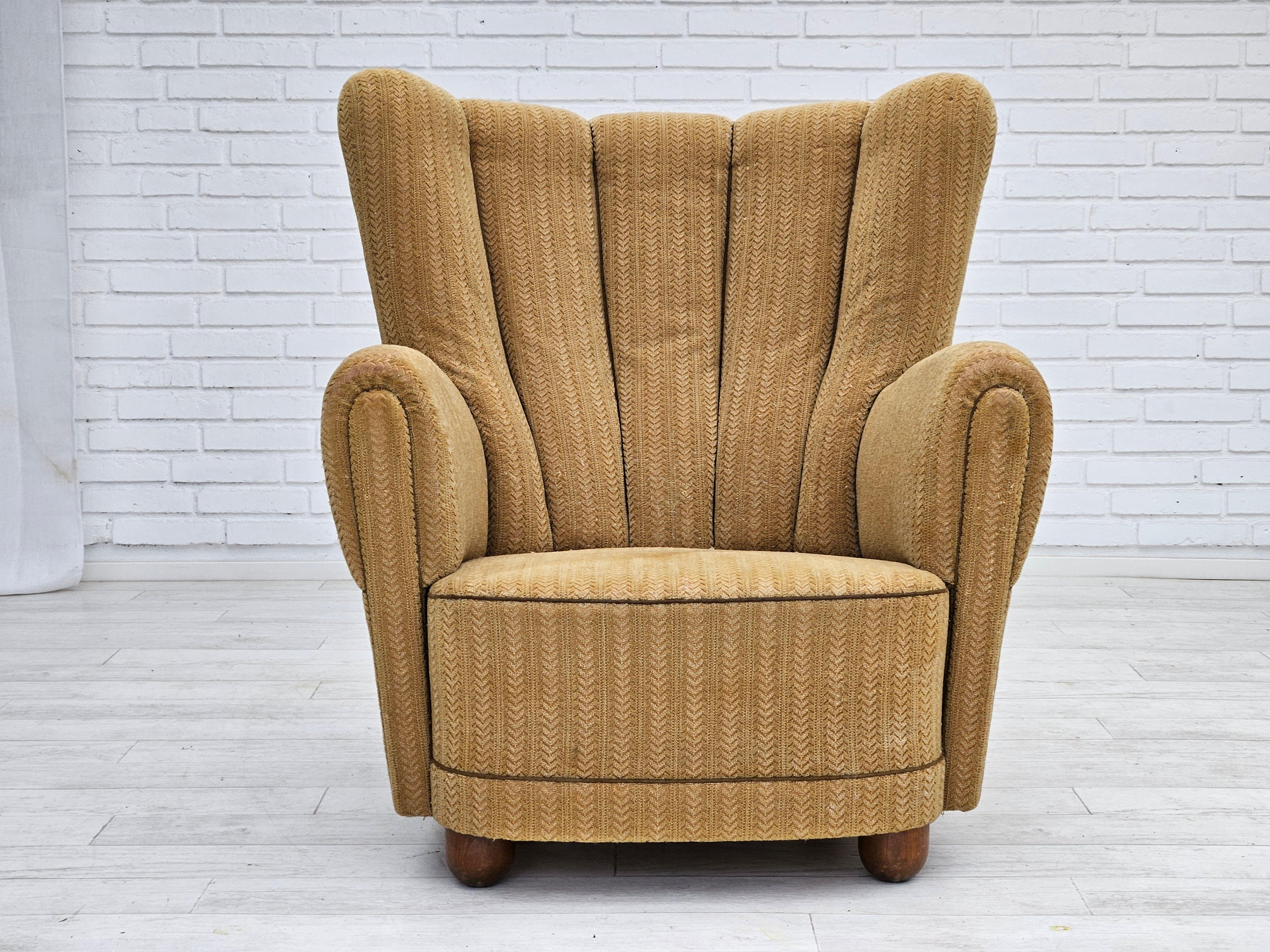1960s, Danish relax chair in original good condition. No smells and no stains, small abrasion of the fabric on the lower back part. Honey colour, cotton/wool fabric. Brass springs in the seat. Oak wood legs. Manufactured by Danish furniture