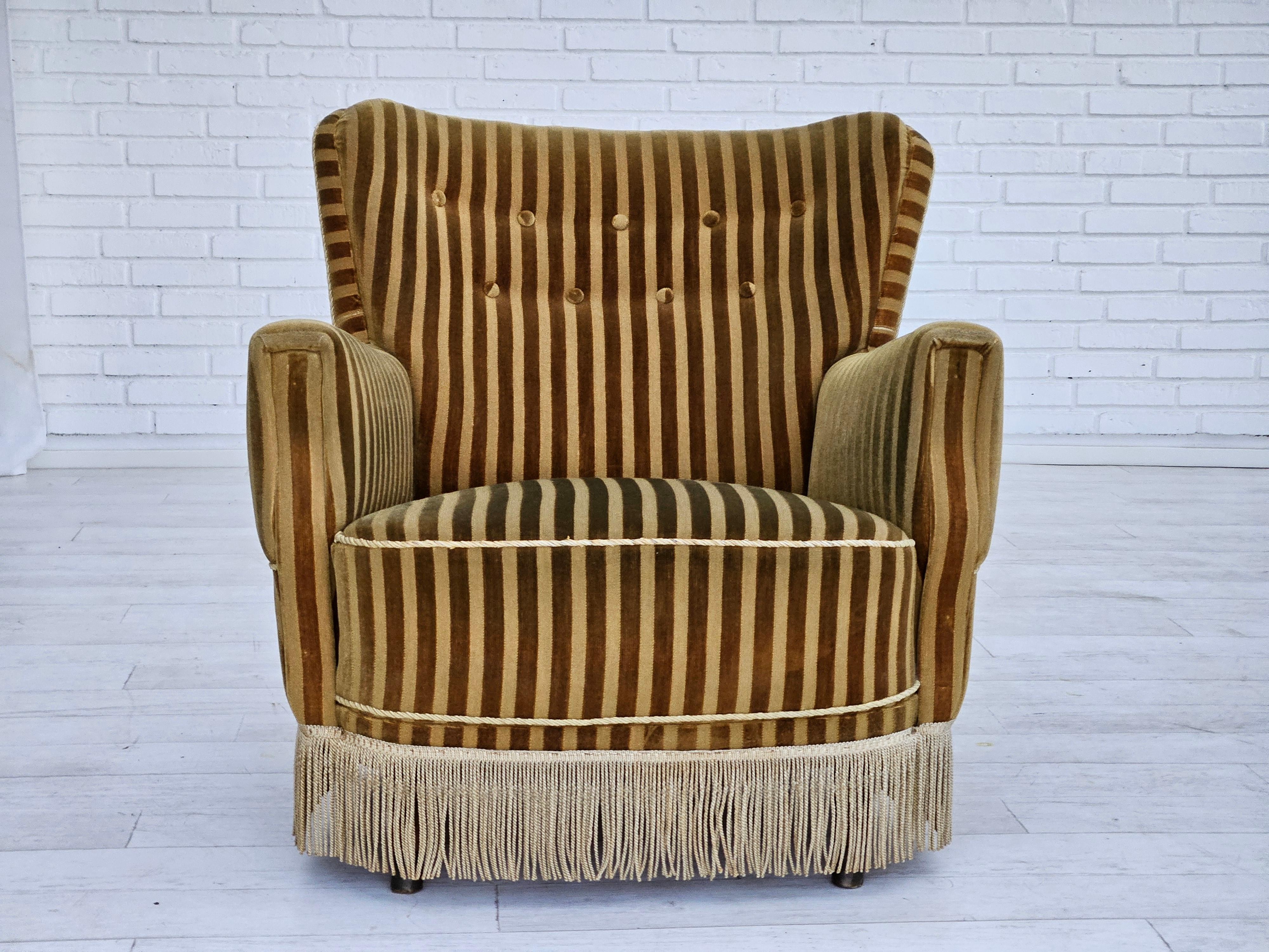 1960s, Danish relax chair in original very good condition: no smells and no stains. Green velour, beech legs with brass plugs. Brass springs in the seat. Manufactured by Danish furniture manufacturer in about 1965s.