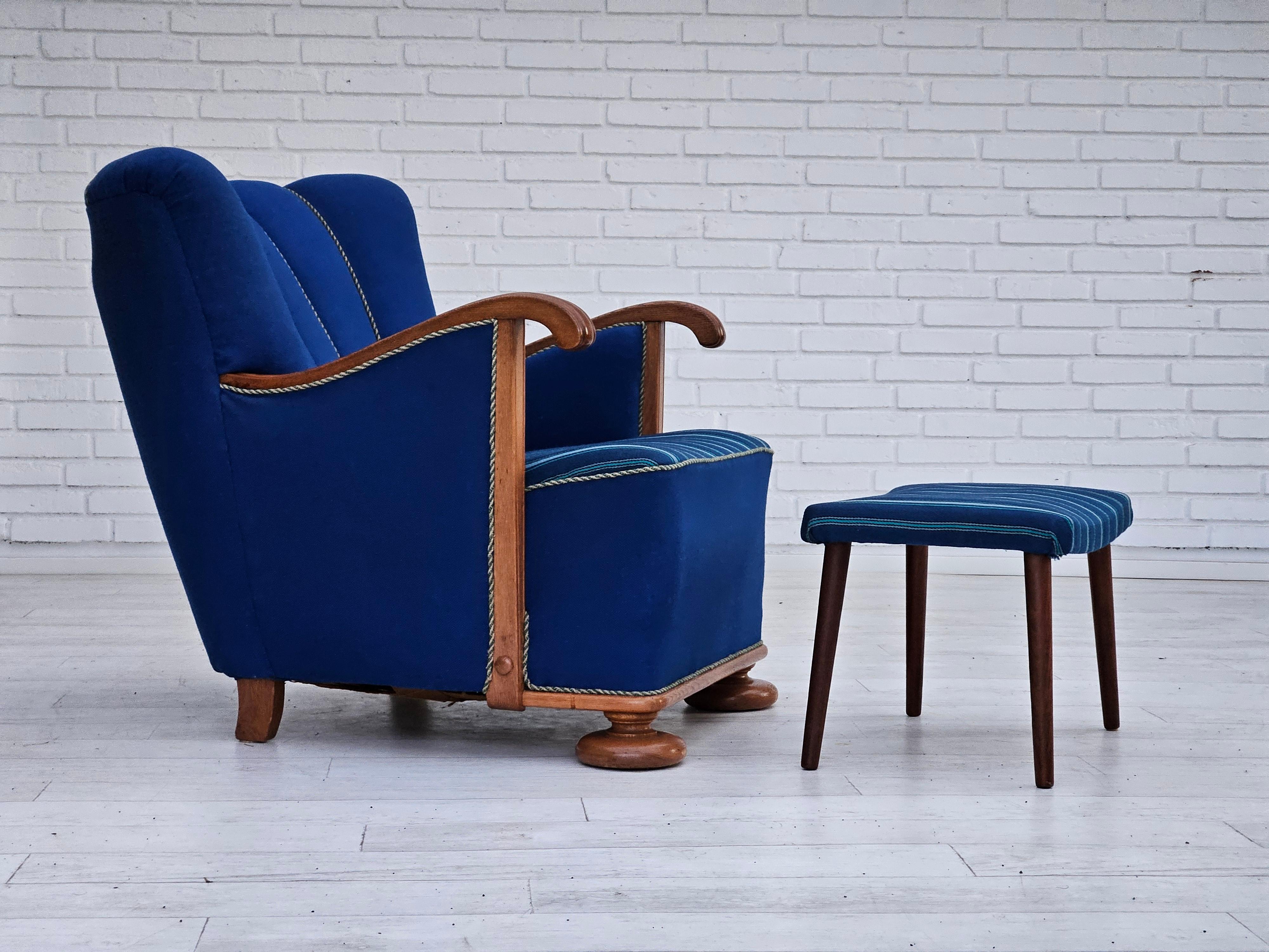 1960s, Danish relax chair with footstool. Reupholstered about 20 years ago. Blue furniture wool, oak wood, brass springs in the seat. Teak wood legs in footstool. Manufactured by Danish furniture manufacturer in about 1955s.