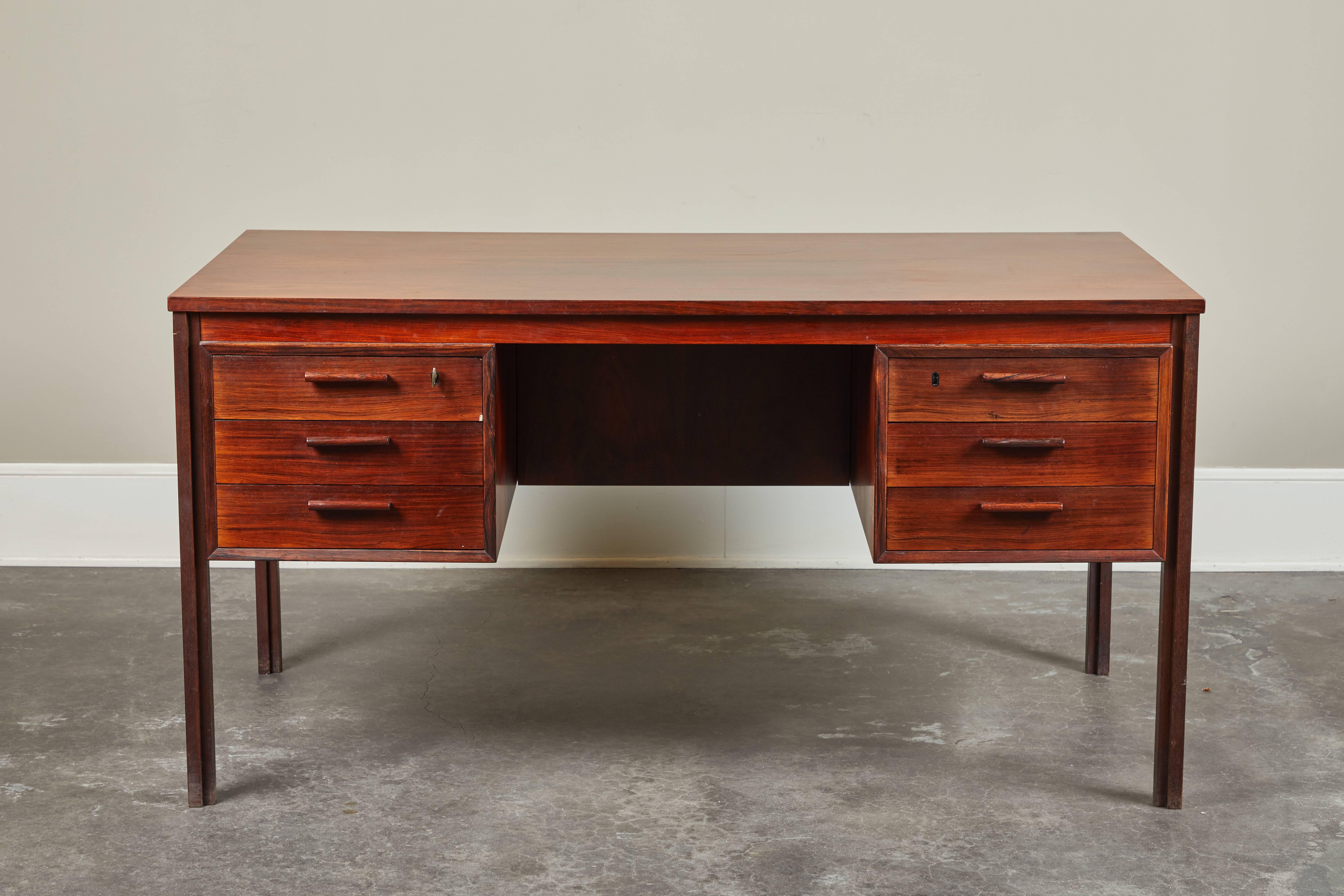 1960s Danish desk by Kai Kristiansen. Features three drawers on either side of desk, as well as open storage on backside.