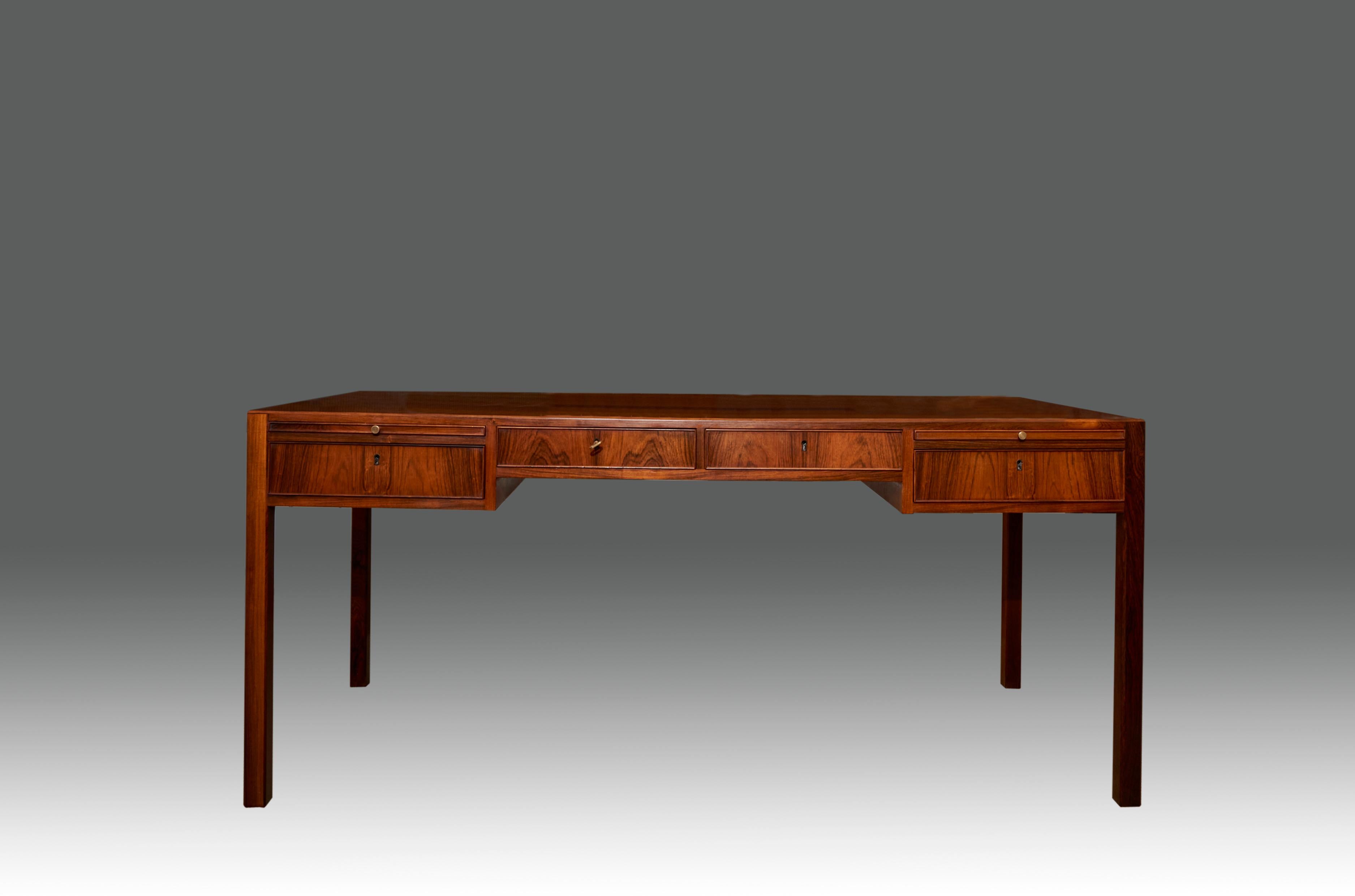 Danish desk by unknown designer. Made in Rosewood with brass handlers. Excellent refinished condition. Denmark, 1960’s.
 