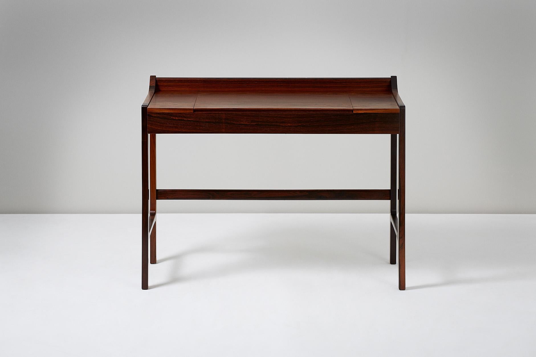 Danish Cabinetmaker

Dressing table, circa 1960

Dressing table made from highly figured exotic hardwood with fold-down mirror on brass fittings. 

Measures: H 77cm, D 50cm, W 55cm, SH 44cm.