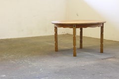 1960s Danish Round Extendable Dining Table in Oak style of Henning Kjærnulf