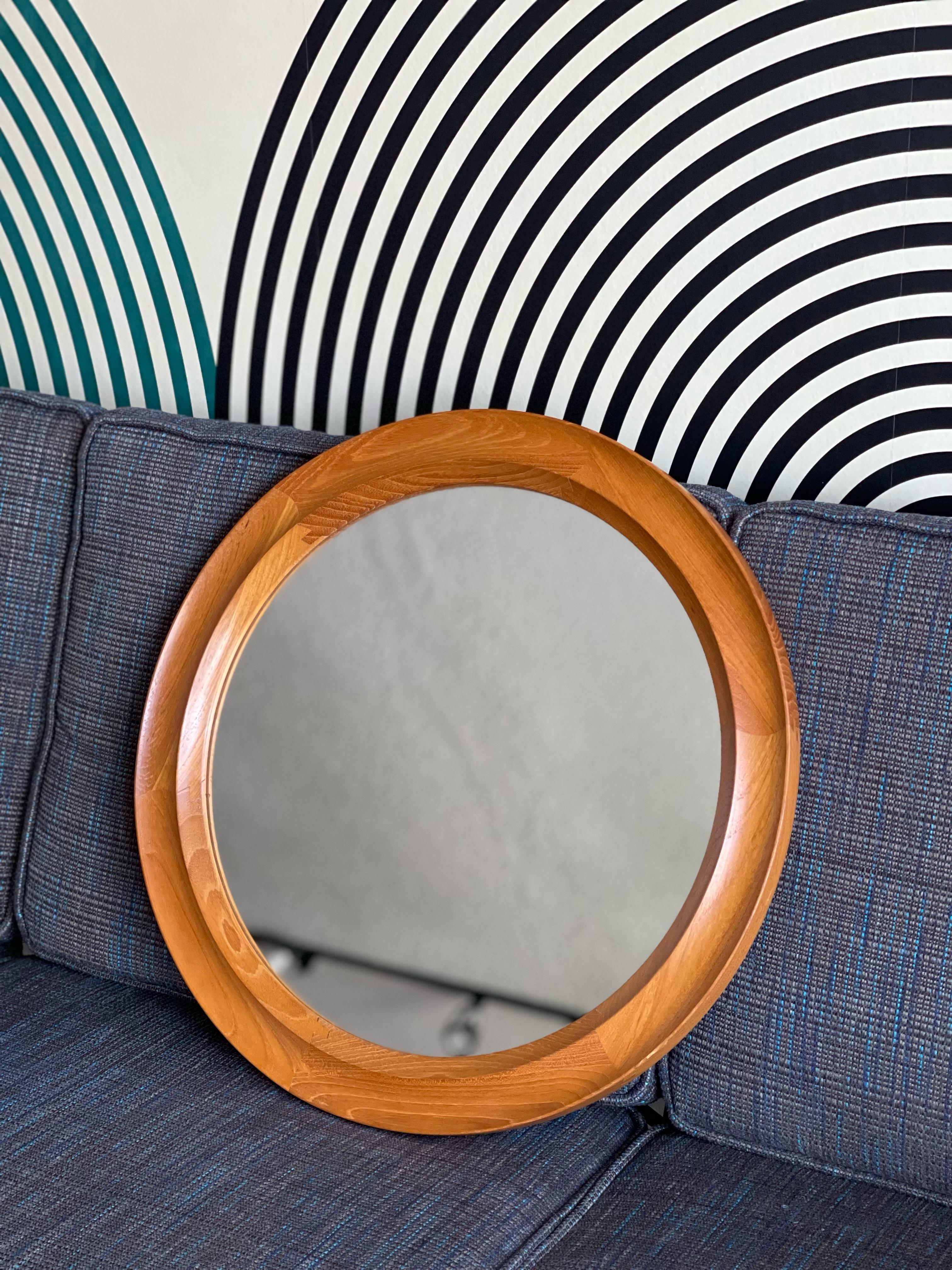 This Danish teak mirror is by Pedersen & Hansen.
c. 1960. 
It's in good vintage condition with some wear on the teak frame consistent with age and use.