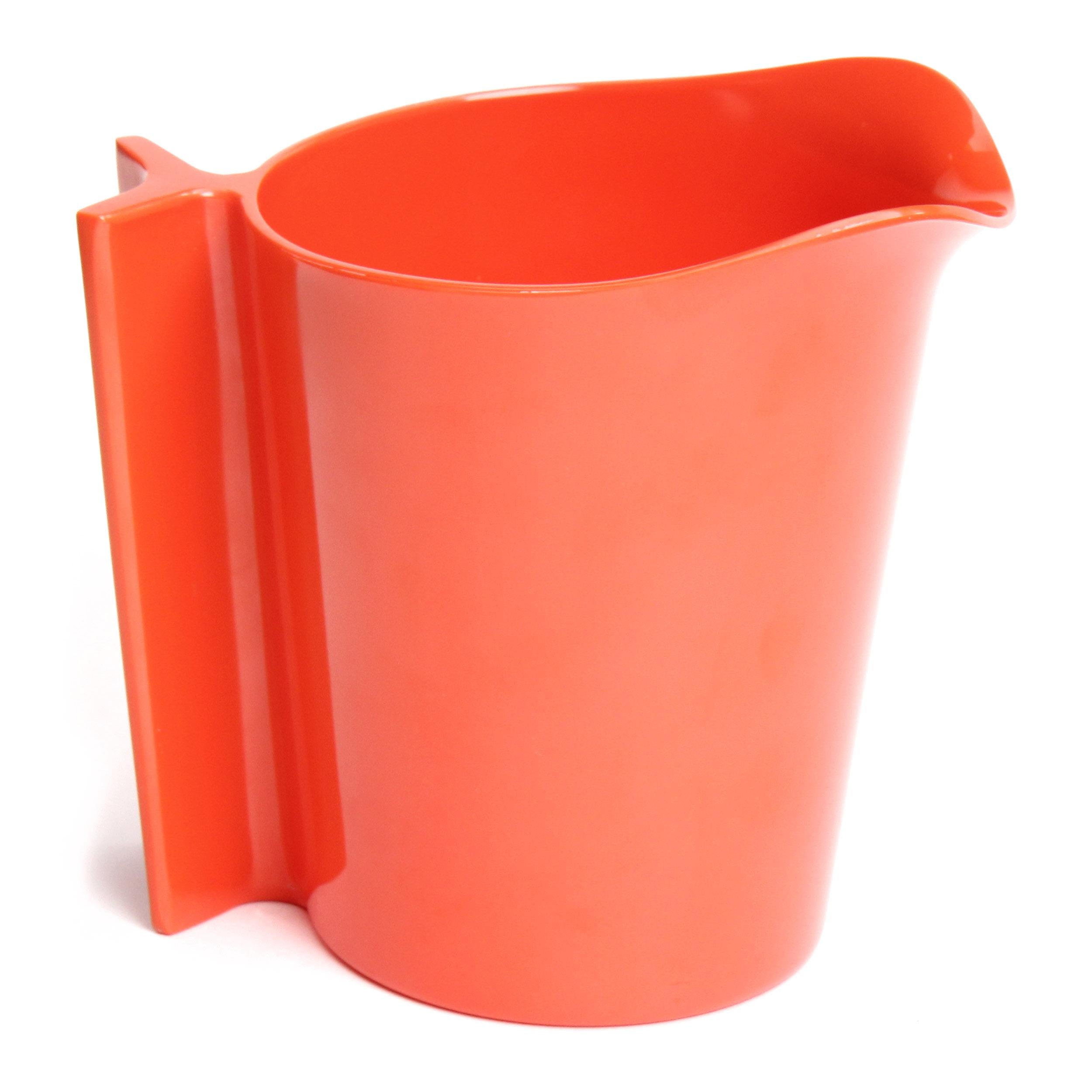 An expressive, uncommon and sculptural pitcher finely executed in vibrant orange plastic.