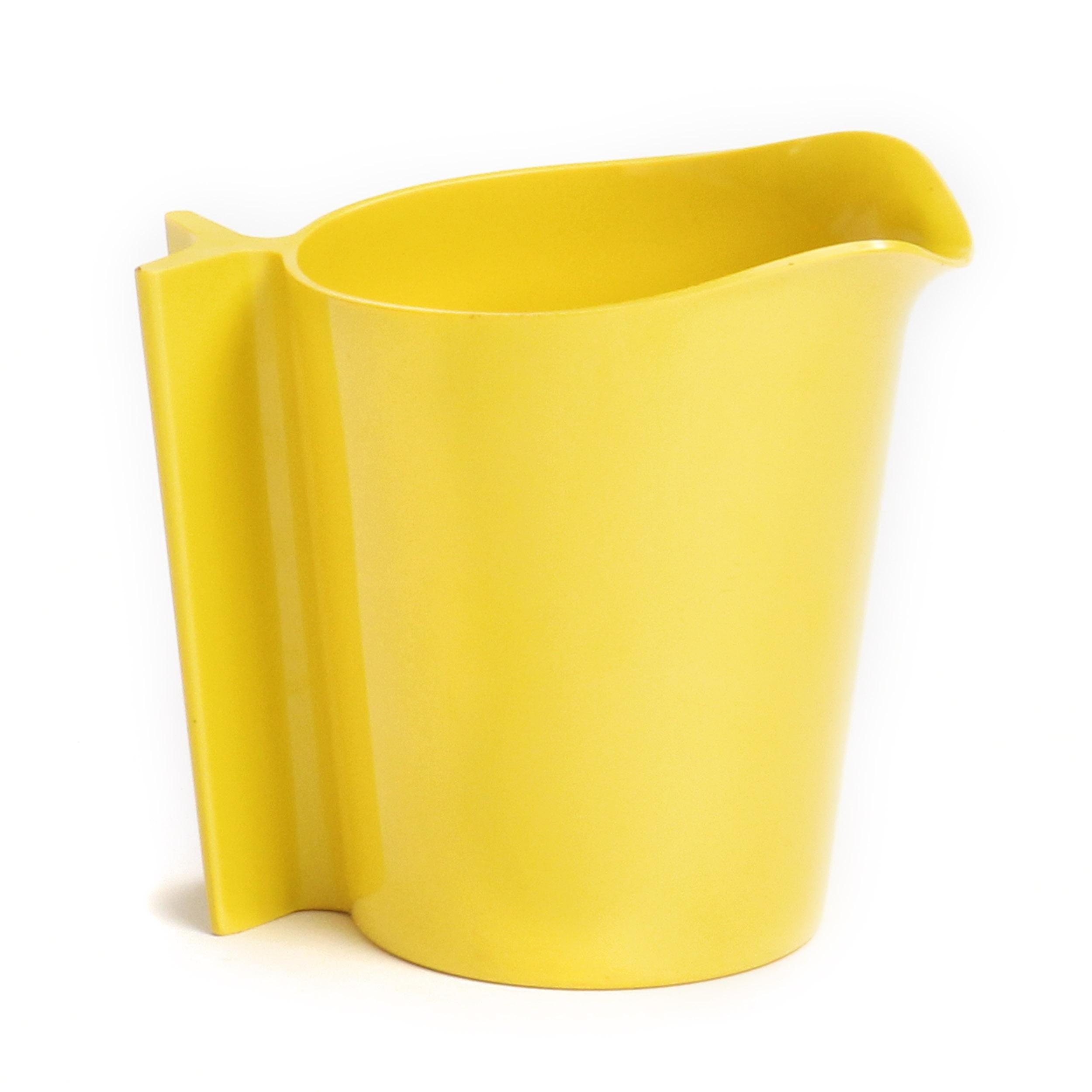 An expressive, uncommon and sculptural pitcher finely executed in vibrant yellow plastic.