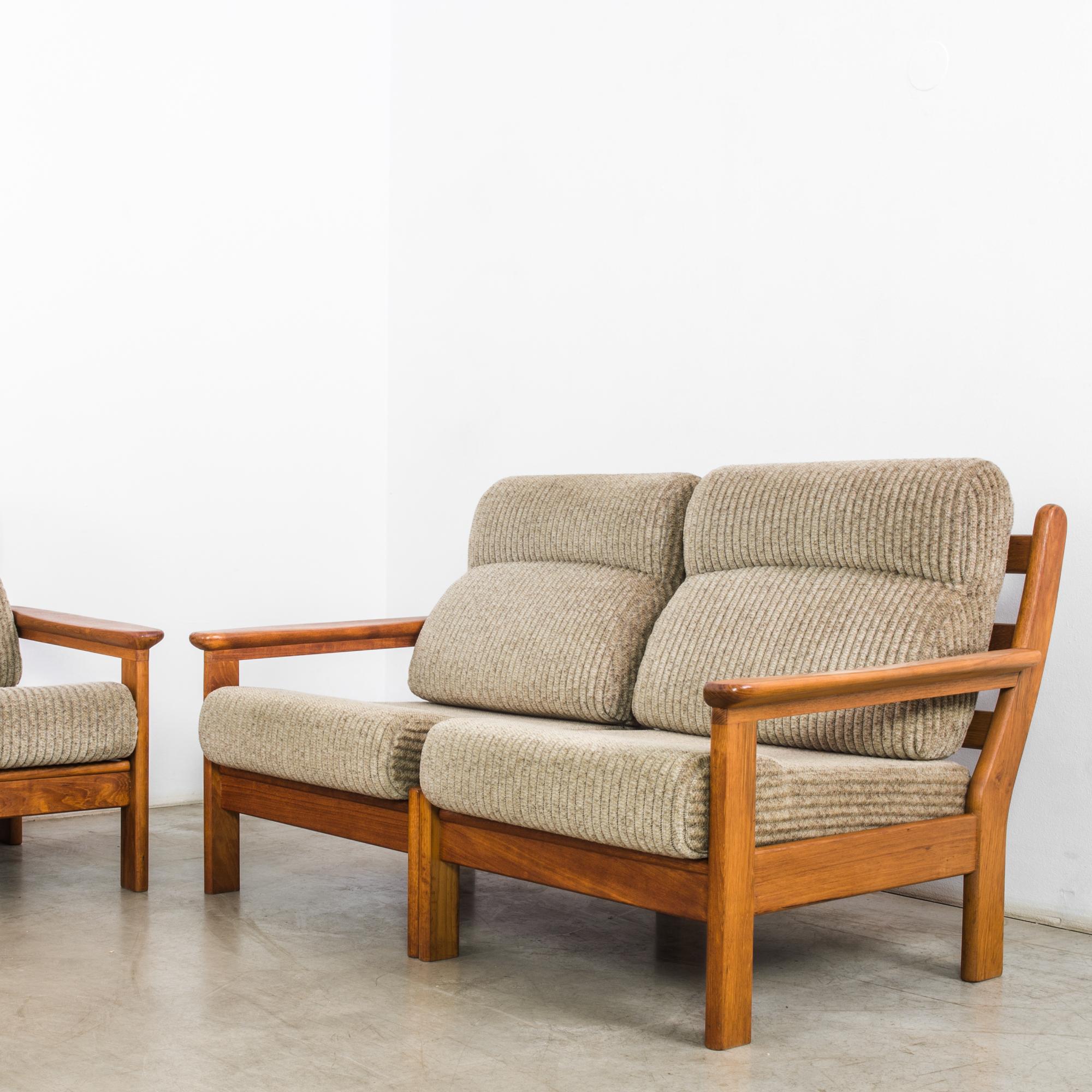In the innovative design landscape of 1960s Denmark, this set of two sofas and an armchair epitomizes the sleek sophistication and minimalist charm of Scandinavian design. Crafted with meticulous attention to detail, these pieces represent the