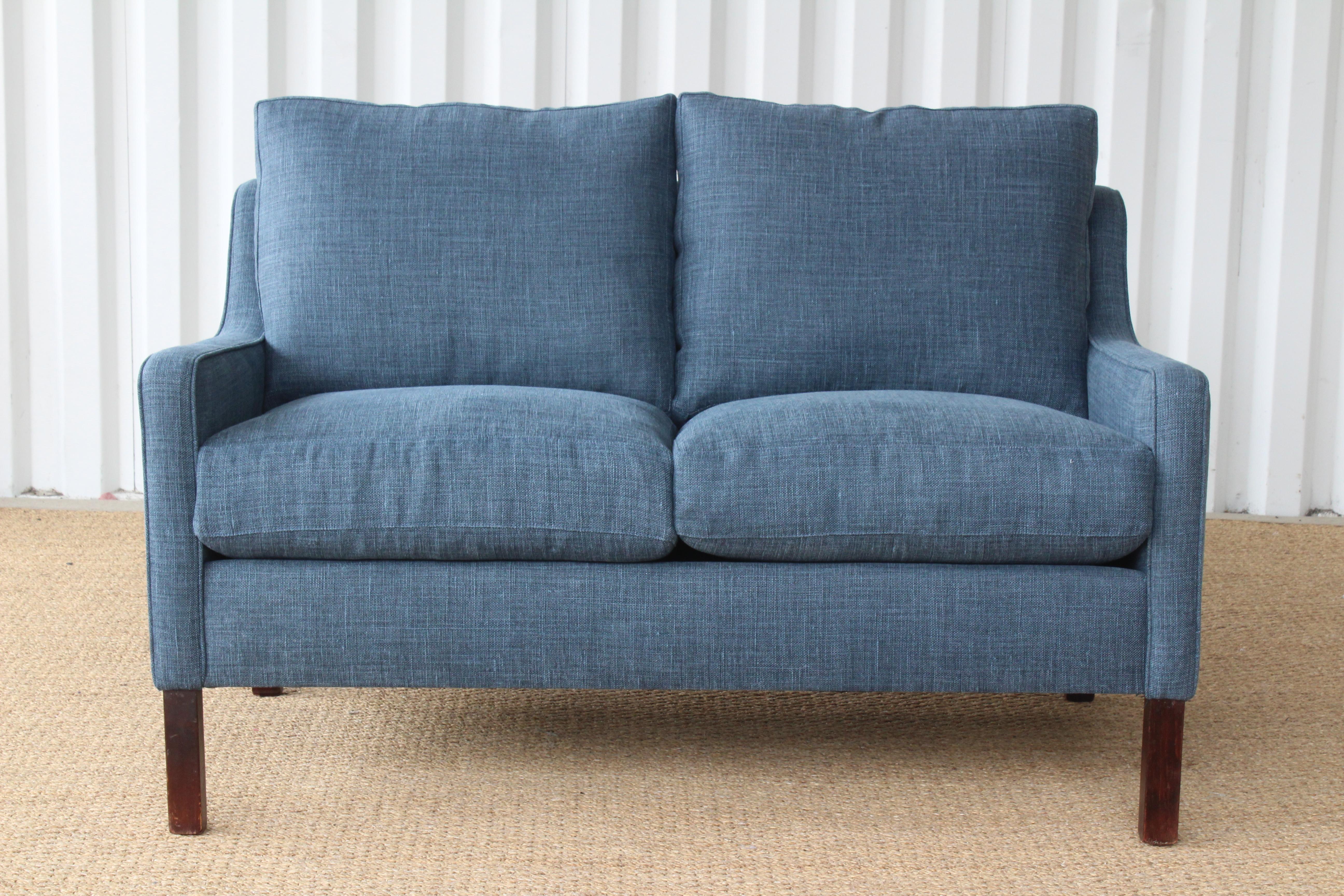 Vintage 1960s Danish modern settee in the style of Borge Mogensen. Newly upholstered in blue Belgian linen. The legs have been kept as is and show age appropriate patina.