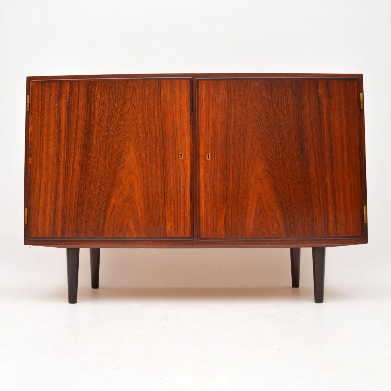 A gorgeous little Danish cabinet on legs, this was designed and made by Poul Hundevad in the 1960s. It’s a very useful size is of amazing quality and is in immaculate condition; we have had this stripped and re-polished to a very high standard.