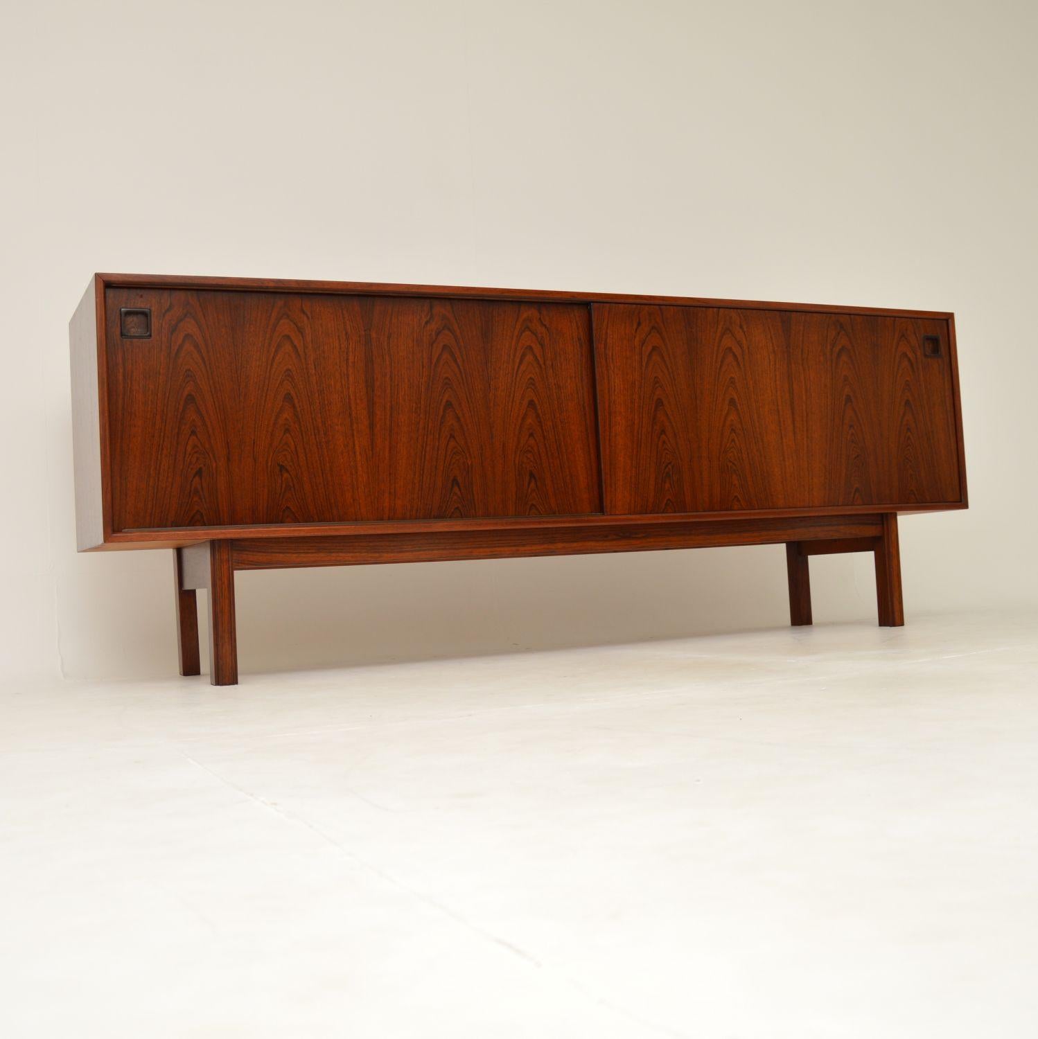 An outstanding Danish vintage sideboard in wood. This is the model 21 sideboard, designed by Gunni Omann and made by Omann Junior; it dates from the 1960’s.

The quality is superb, this is beautifully made and has an extremely stylish design. The