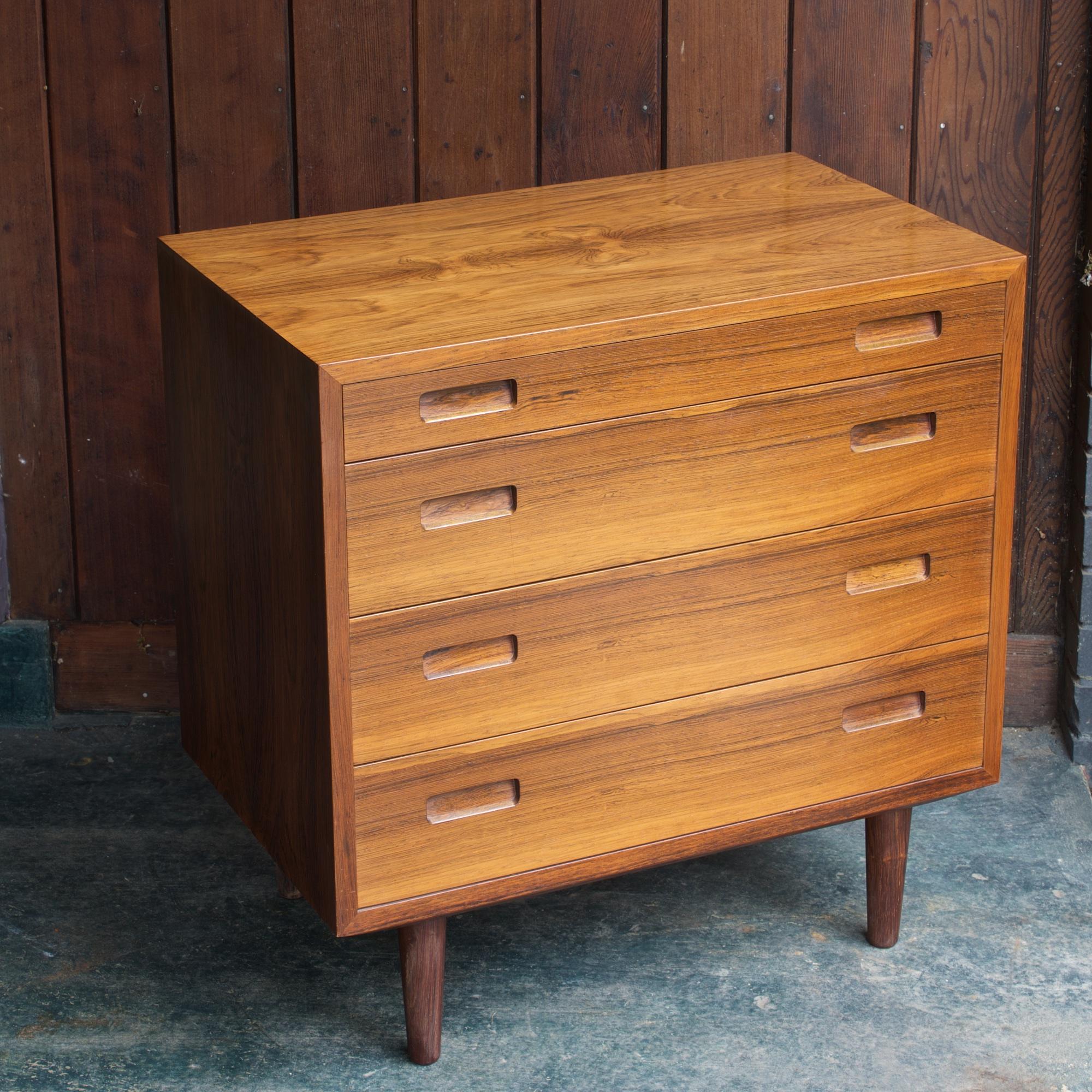 Rare inset minimalist drawer pulls, and wonderful figured side grain on each side of the case, bookmatched grain up one side across the top and down the other. A clean unit with smooth functioning drawers. We also have a matching double bank dresser