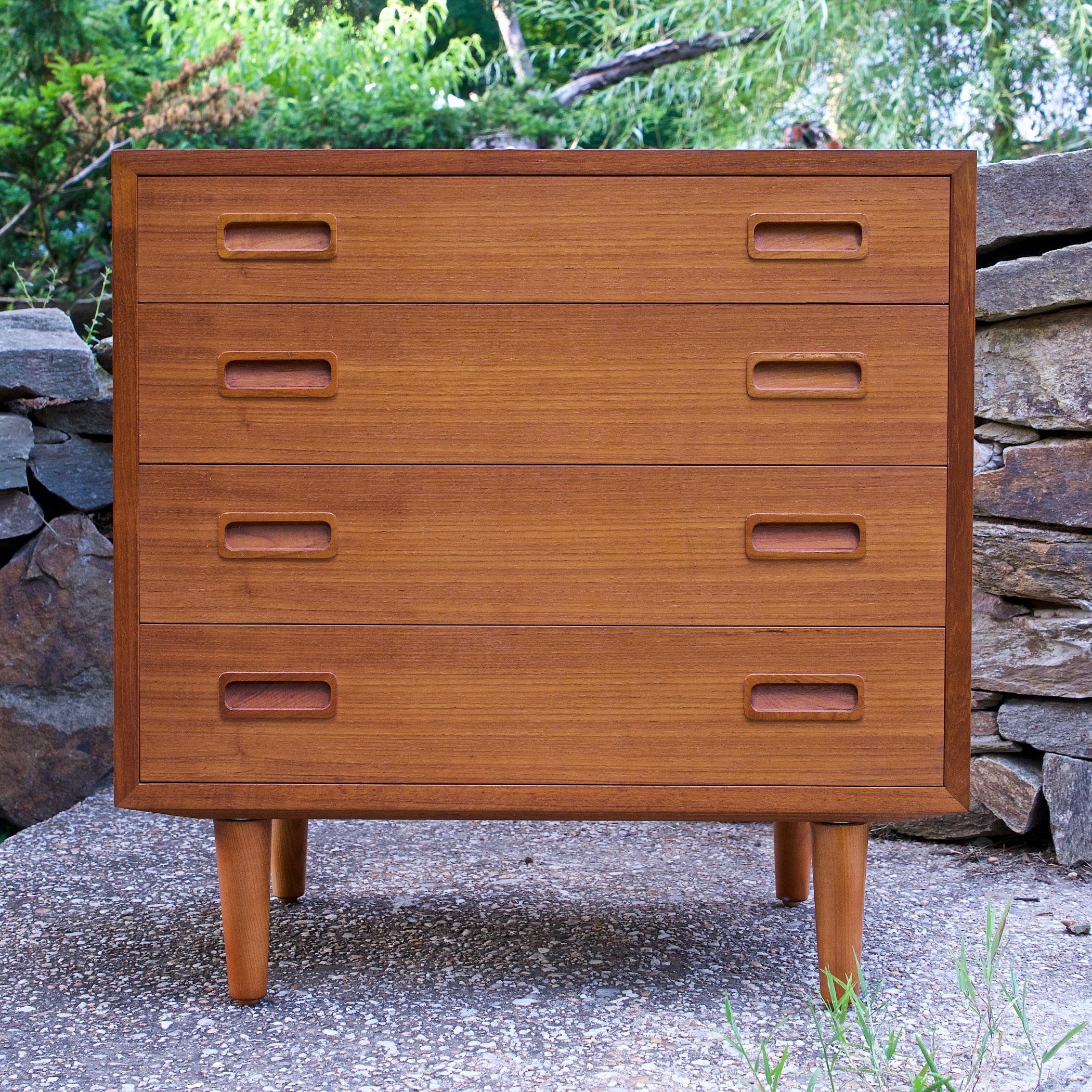 Rare inset minimalist drawer pulls, and wonderful figured side grain on each side of the case, bookmatched grain up one side across the top and down the other. A clean unit with smooth functioning drawers. We also have a matching double bank dresser