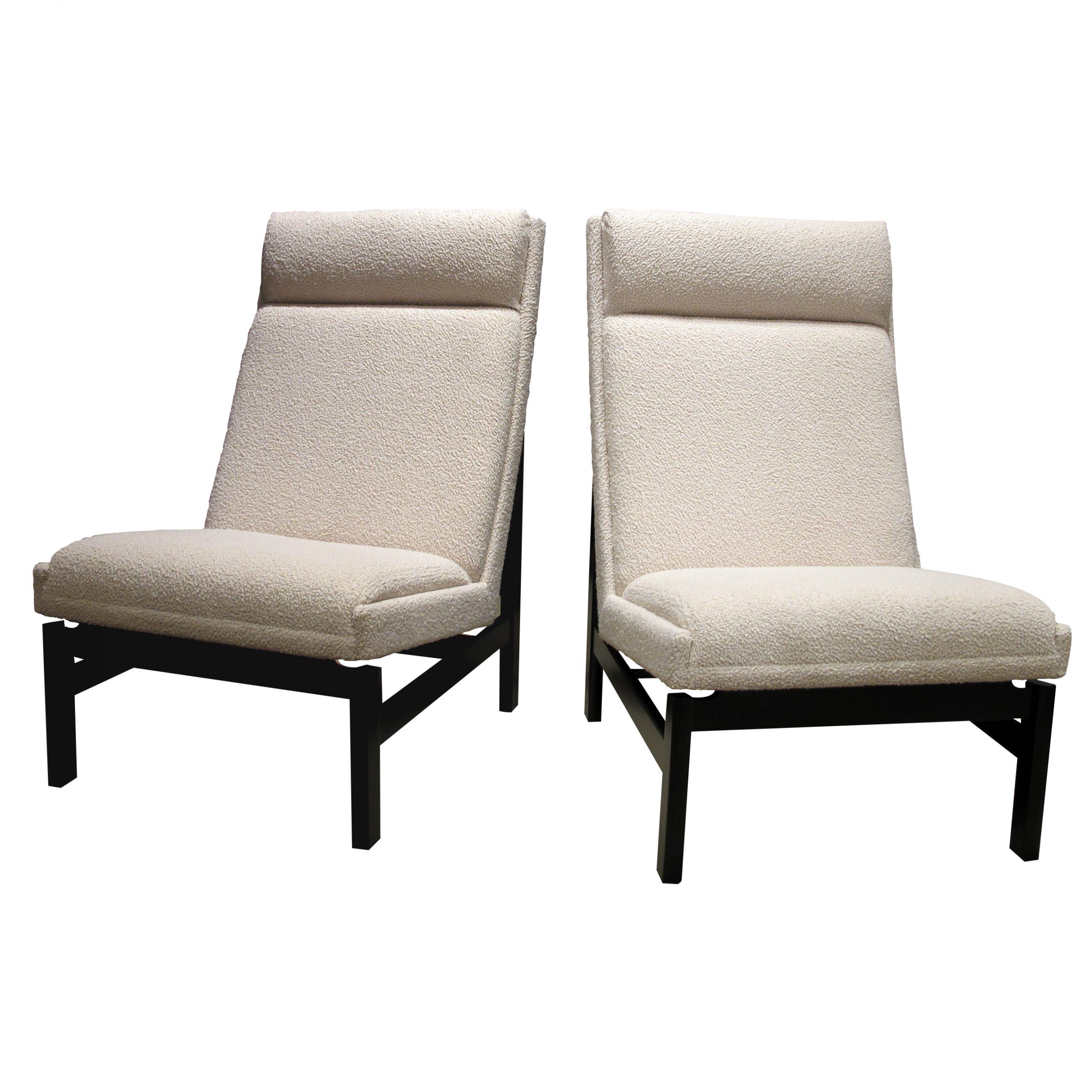 This is a very elegant comfortable and structural pair of 1960s Danish armchairs with the seat and backrest presented on a dark wooden frame highlighting the straight line and curves of the backrest and seat. These well-made armchairs have been