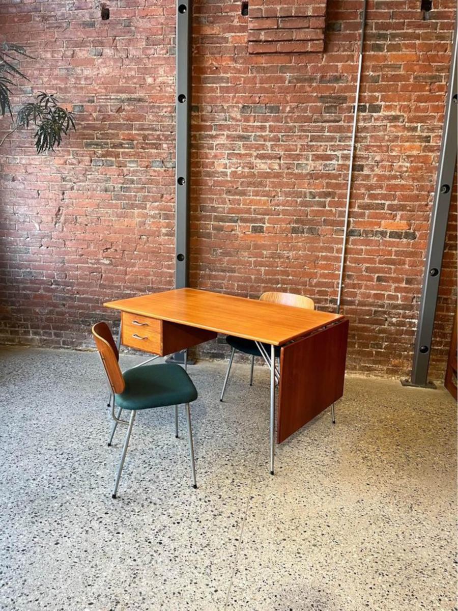 Embrace timeless elegance with this rare teak desk by Børge Mogensen for Søborg Møbelfabrik. Model '203' showcases Mogensen's innovative use of steel, adding a modern touch to its classic teak construction. Crafted in 1953, this Scandinavian modern