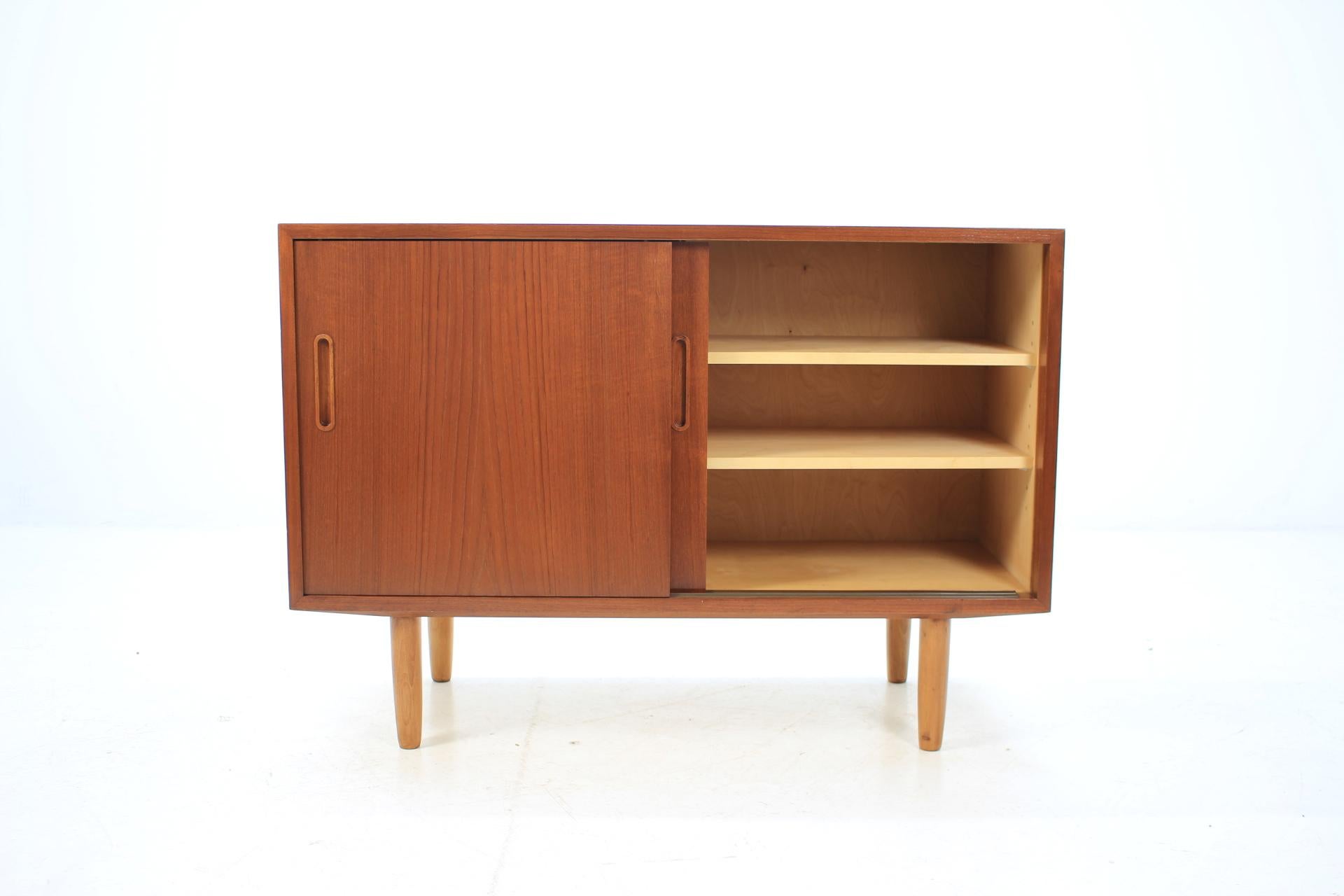 This sideboard features two doors, three adjustable shelves and one small drawer. This item was carefully restored.