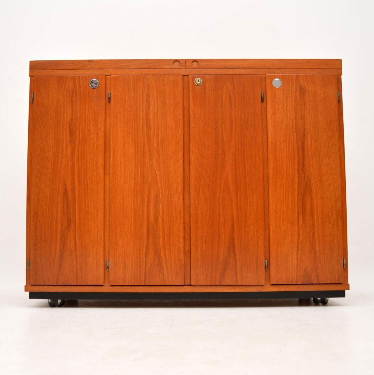 A stunning and very rare captains bar / cabinet in teak, this was made in Denmark by Dyrlund, it dates from the 1960s. The quality is amazing, and the condition is superb throughout; we have had this stripped and re-polished to a very high standard.