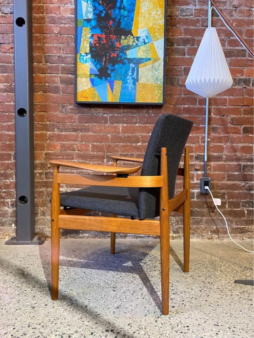 An exceedingly rare find, this exquisite Model FD 192 chair, designed by  Finn Juhl for France & Son in the 1960s, is a true gem. Notable for its striking, sculptural armrests and the illusion of a 