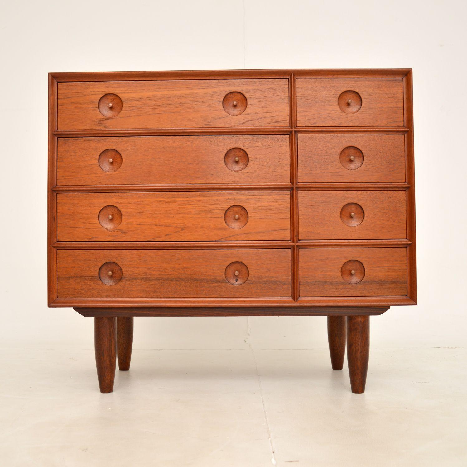 A beautiful and very unusual Danish chest of drawers in teak. This was made in Denmark, it dates from around the 1960’s.

The quality is amazing, this is made completely of solid teak with wood veneers on the top, sides and back. It is extremely