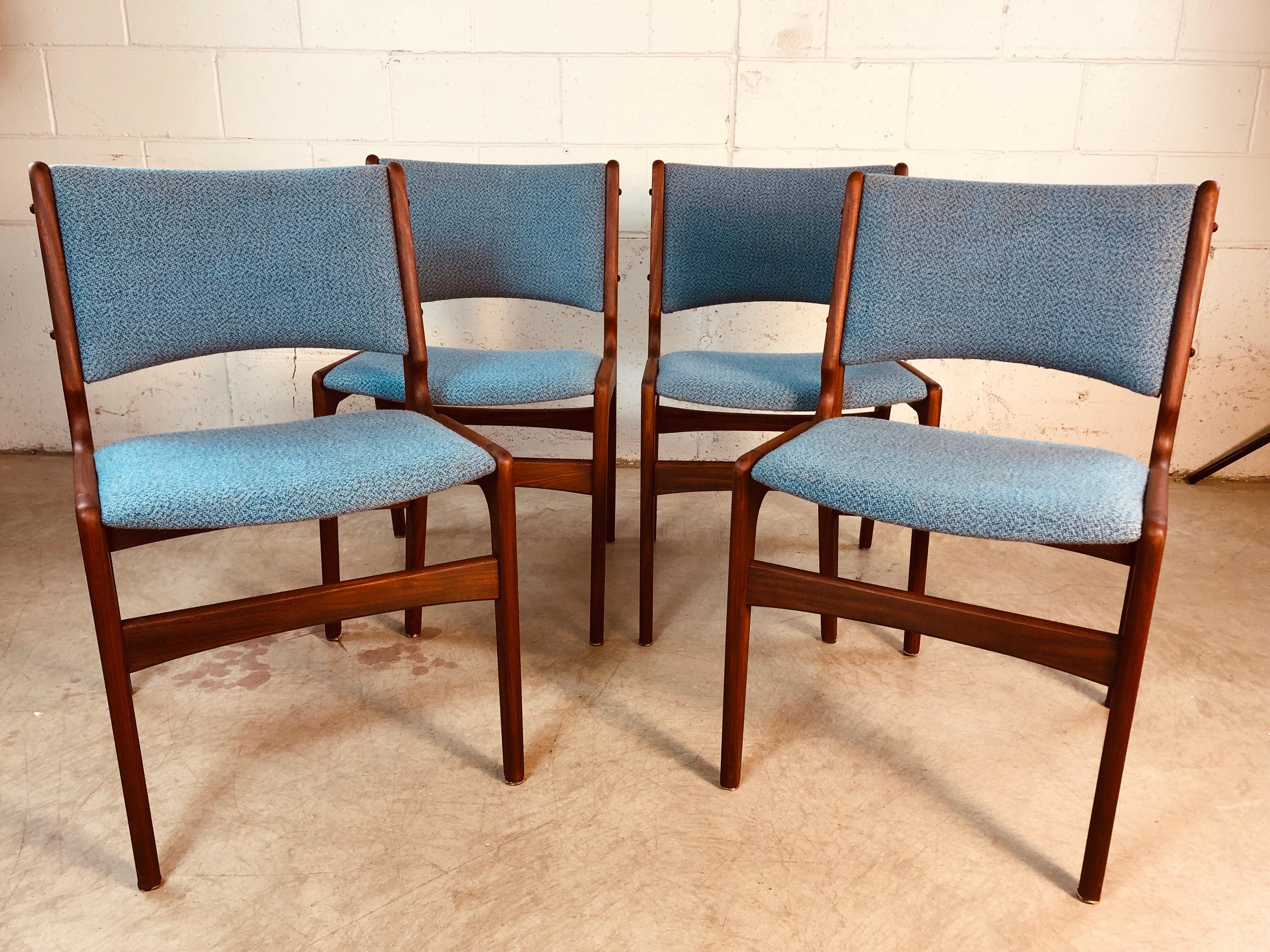 1960s Danish teak set of 4 dining room chairs with the original tweed fabric. The chairs have a nice dark teak finish and have been fully restored. No marks.
