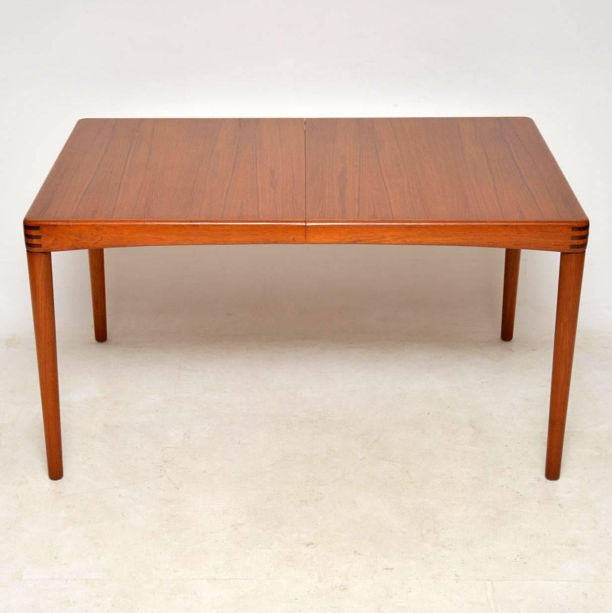 A superb Danish vintage dining table, this was designed by Henry Klein for Bramin, it dates from the 1960s. It is predominantly teak, with beautiful dark wood biscuit joints on the corners. We have had this stripped and re-polished to a very high
