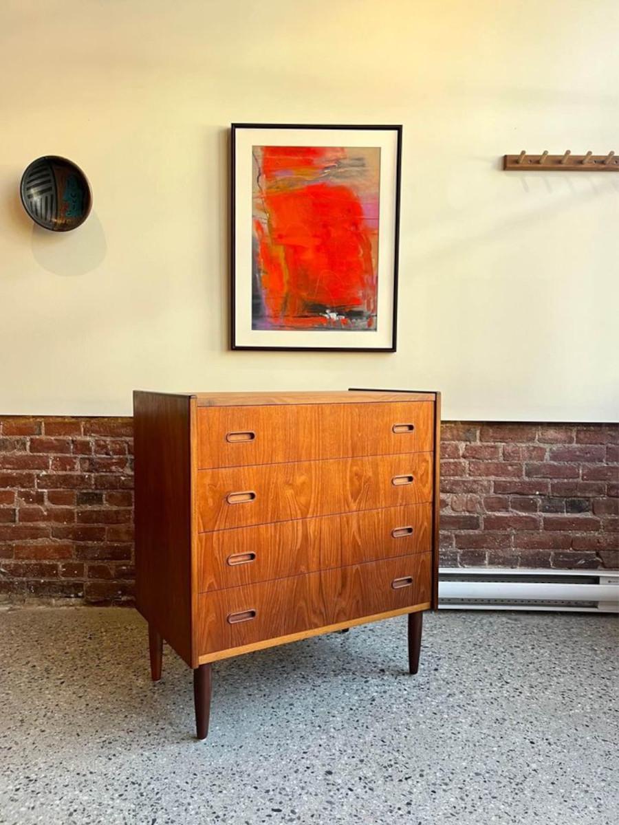 Introducing this expertly crafted 1960's Danish Teak Dresser, boasting four drawers adorned with a distinct and minimalist pull design and dovetail joinery. Effortlessly exuding charm and functionality, this dresser has been meticulously refinished