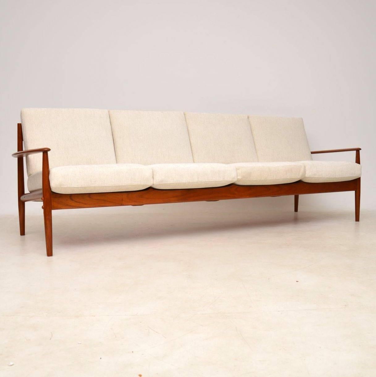 A stunning and very rare Danish teak sofa by Grete Jalk, this is a very large four seat version, made by France & Son and dating from the 1960s. The quality is fantastic as you’d expect, and the condition is superb throughout. We have had the frame