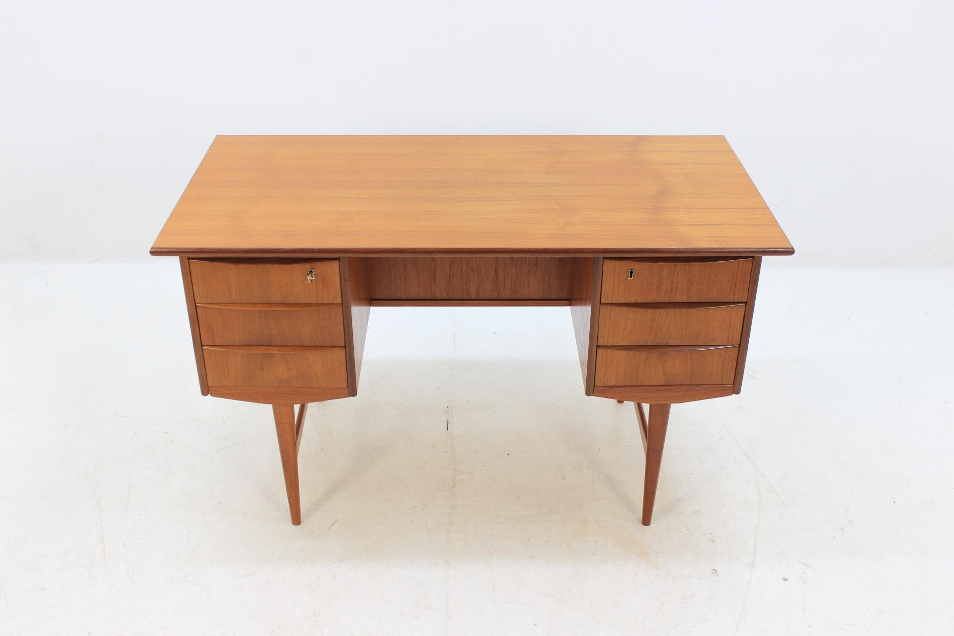 The desk features lockable six drawers and has open storage space on the back side. This item was carefully restored.