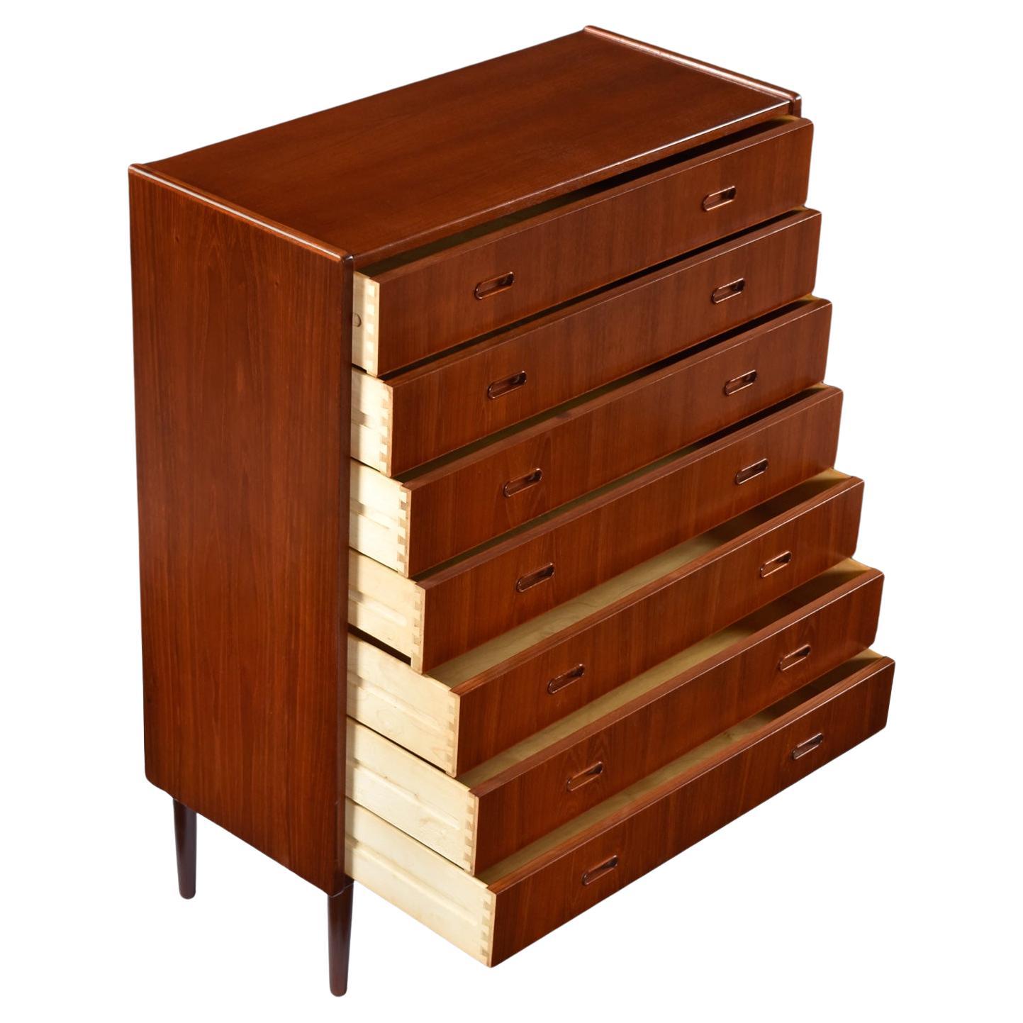 Just look at the matched pattern grain drawer fronts on this early Danish highboy. The fiery cathedrals cover all 7-drawers and showcase the use of the natural elements to compliment the Scandinavian design. This chest is an exemplary specimen of