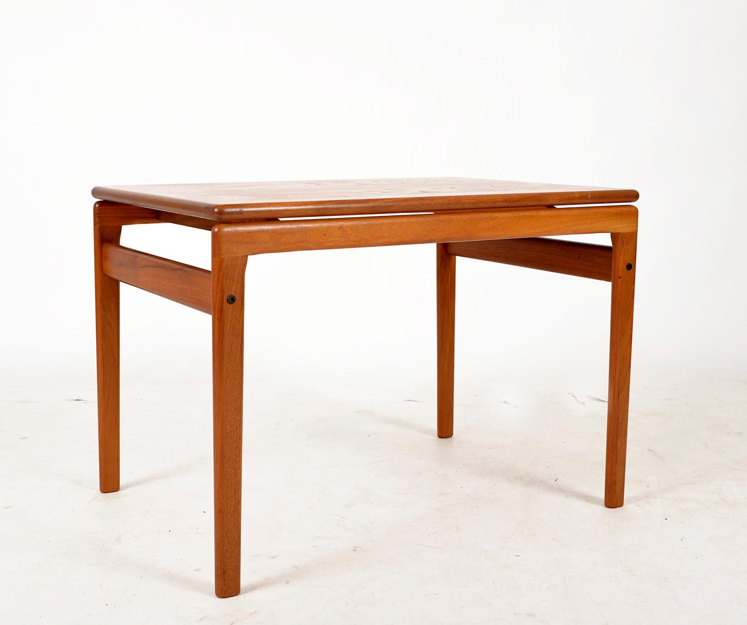 A well looked after 1960s Danish teak floating coffee / side table Branded “Trioh made in Denmark” to the underside. The clever design of the table gives the impression that the top is floating. It has a good colour and an attractive grain,