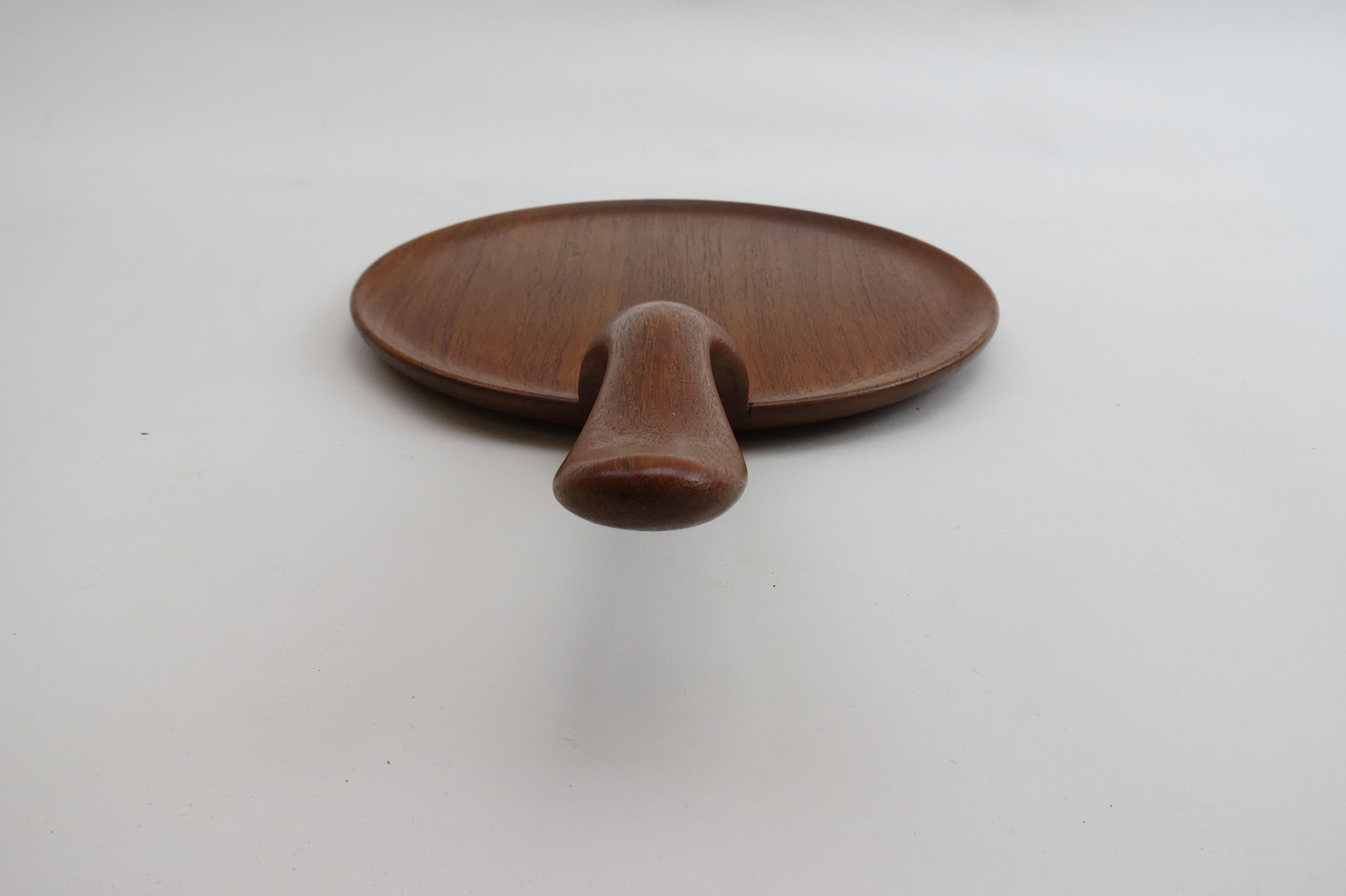 Teak serving tray from the 1960s, designed by Kay Bojesen

Stamped on the underside: Kay Bojesen, Denmark, Teak

St 834.