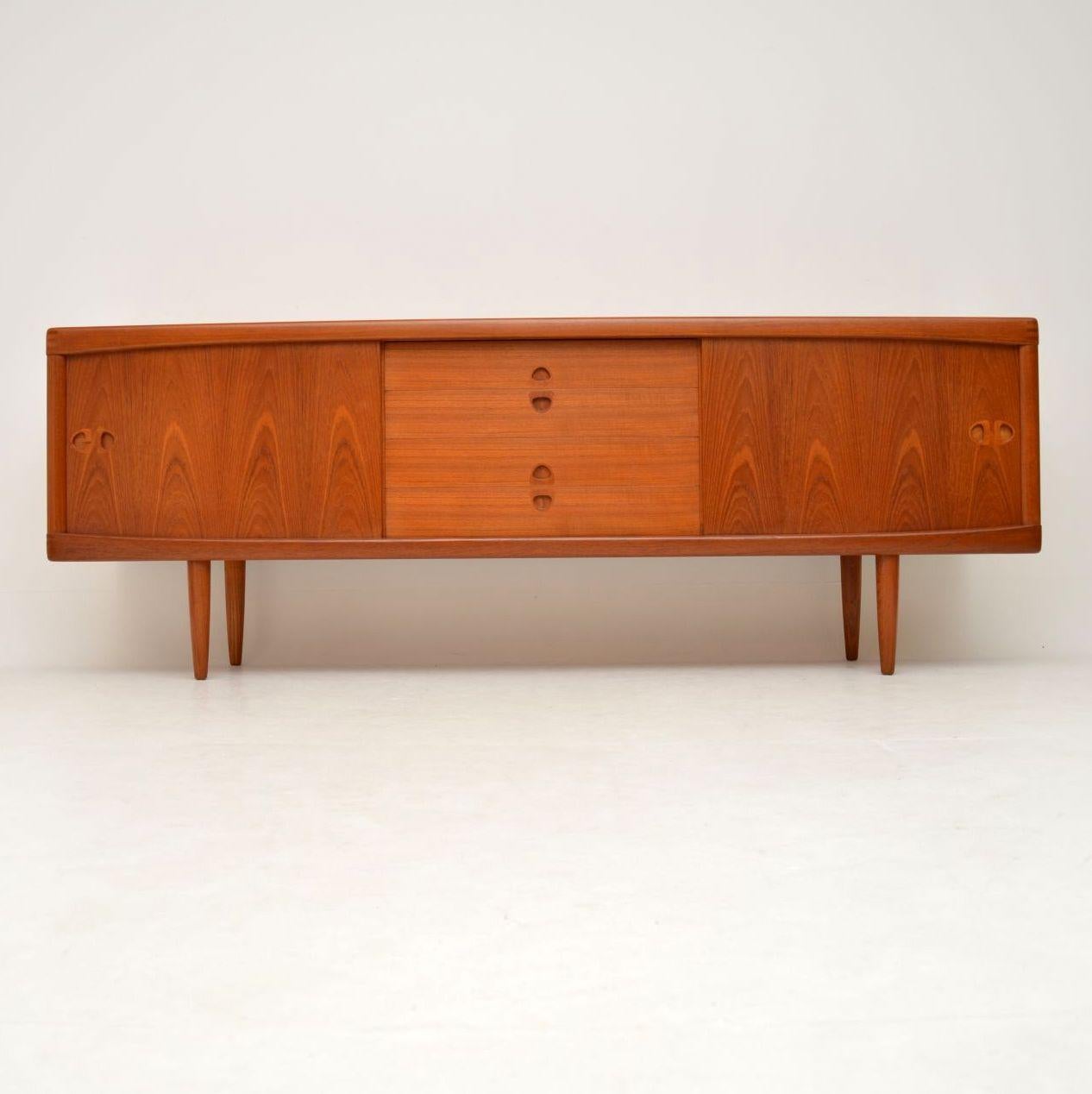 A stunning vintage Danish sideboard in teak, this was designed by HW Klein and was made by Bramin in the 1960s. We have had this stripped and re-polished to a very high standard, the condition is immaculate throughout. There are lots of beautiful