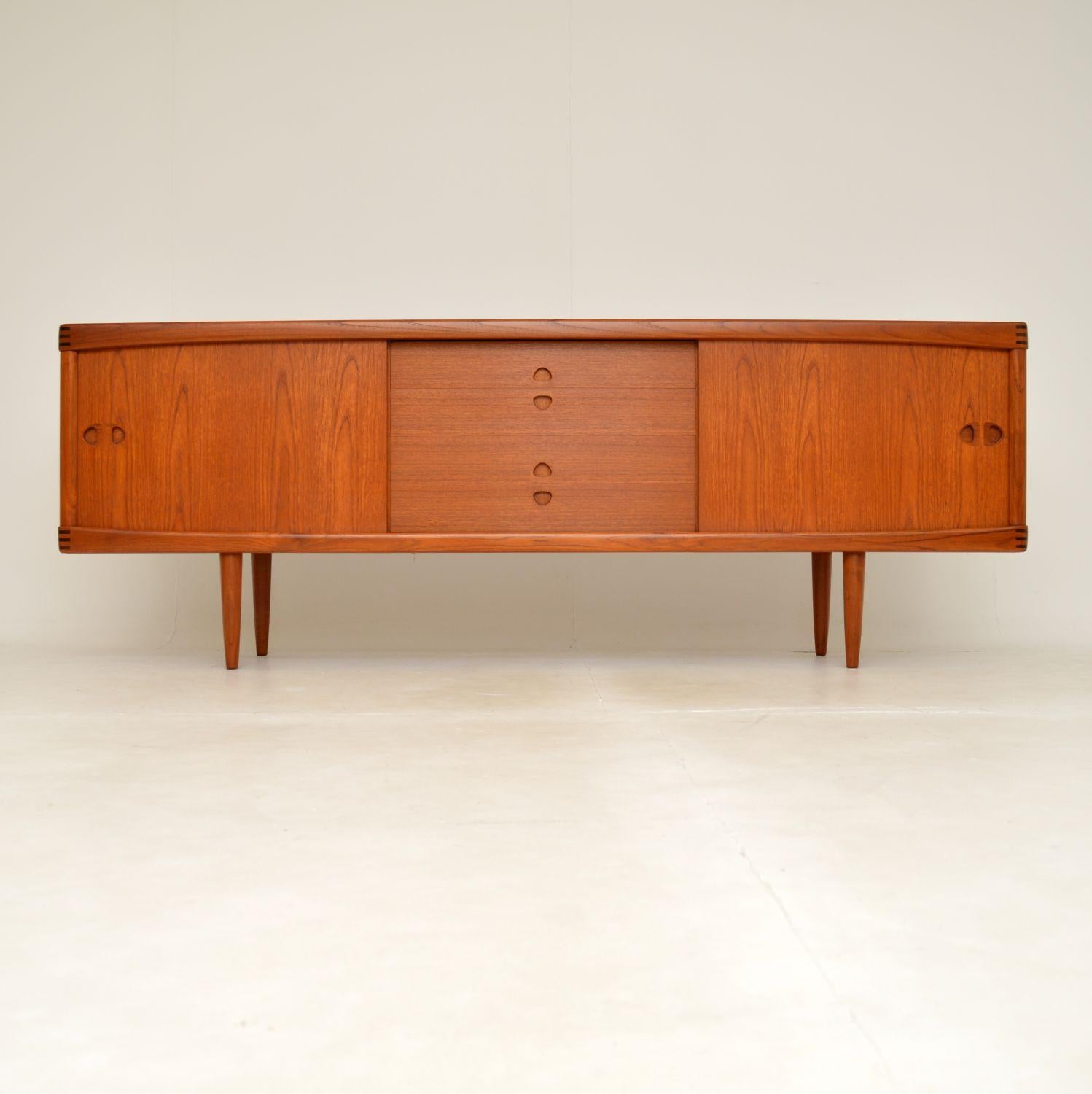 A fantastic vintage Danish sideboard in teak. This was designed by H.W Klein, it was made by Bramin in Denmark and dates from the 1960’s.

The quality is outstanding, this is extremely well made with many fine features. The edges are beautifully