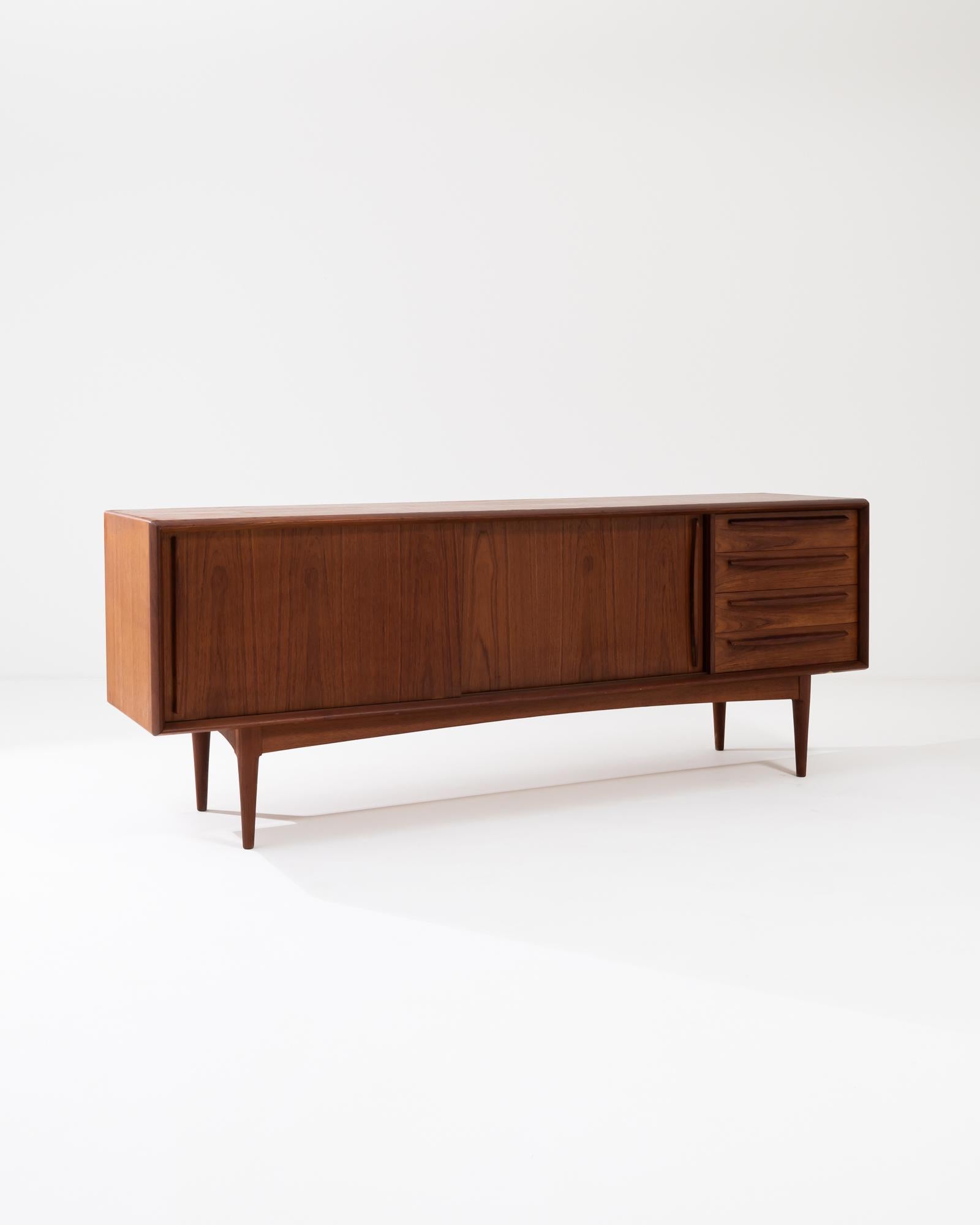 A wooden cabinet made in 1960s Denmark. Sleek geometric design and gleaming solid teak wood are Classic staples of midcentury Danish design. This long cabinet is composed with a surplus of drawers, three interior drawers on the left, and a four