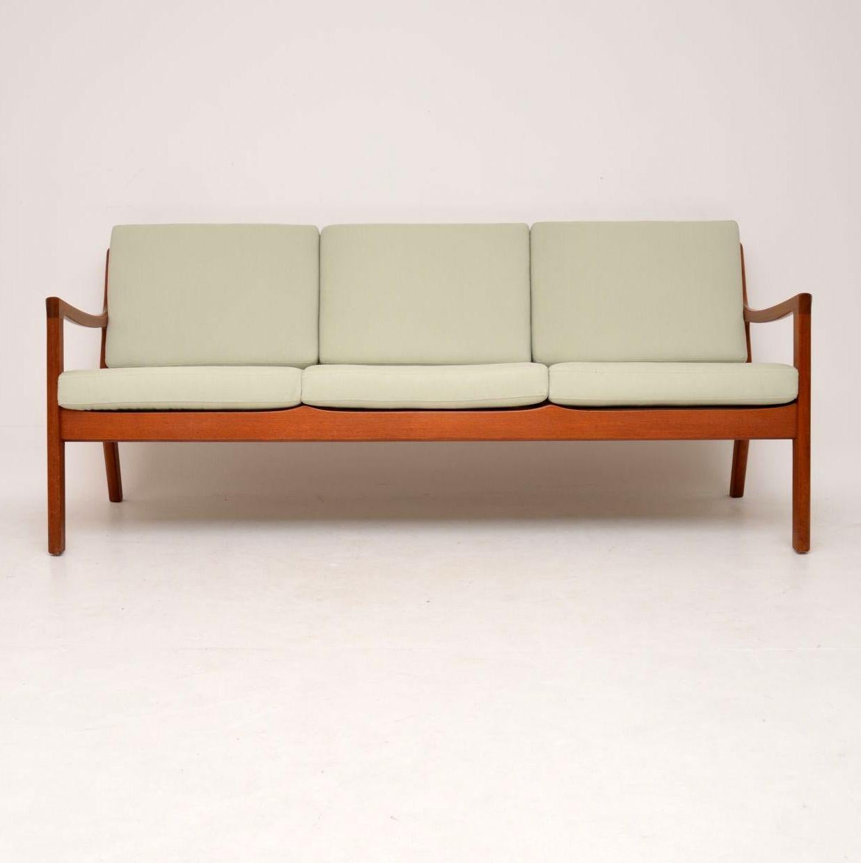 A stunning Danish sofa in solid teak, this model is called the ‘Senator’, it was designed by Ole Wanscher and was made by France & Son in the 1960s. It’s in excellent condition for it’s age, the teak frame is clean, sturdy and sound, with only some